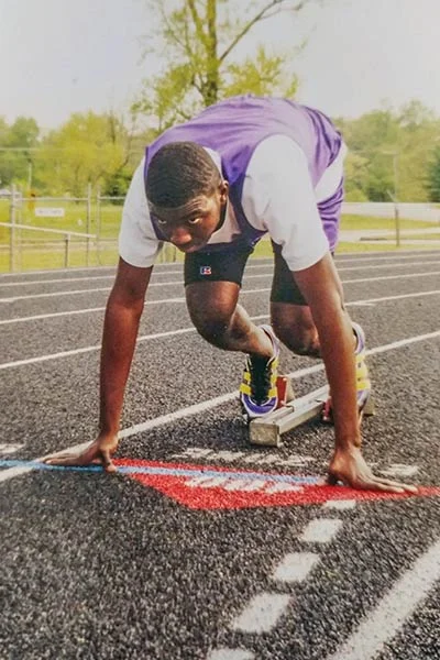 Thalas Steele running track for Central High School in Columbia, TN, 1999.