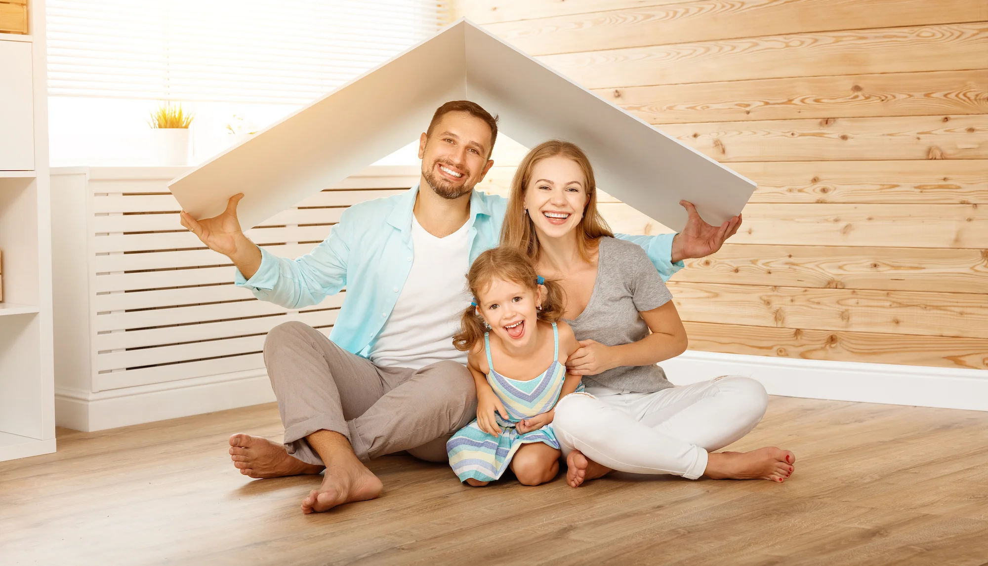 Family sitting under box in house - ECFCU.jpg