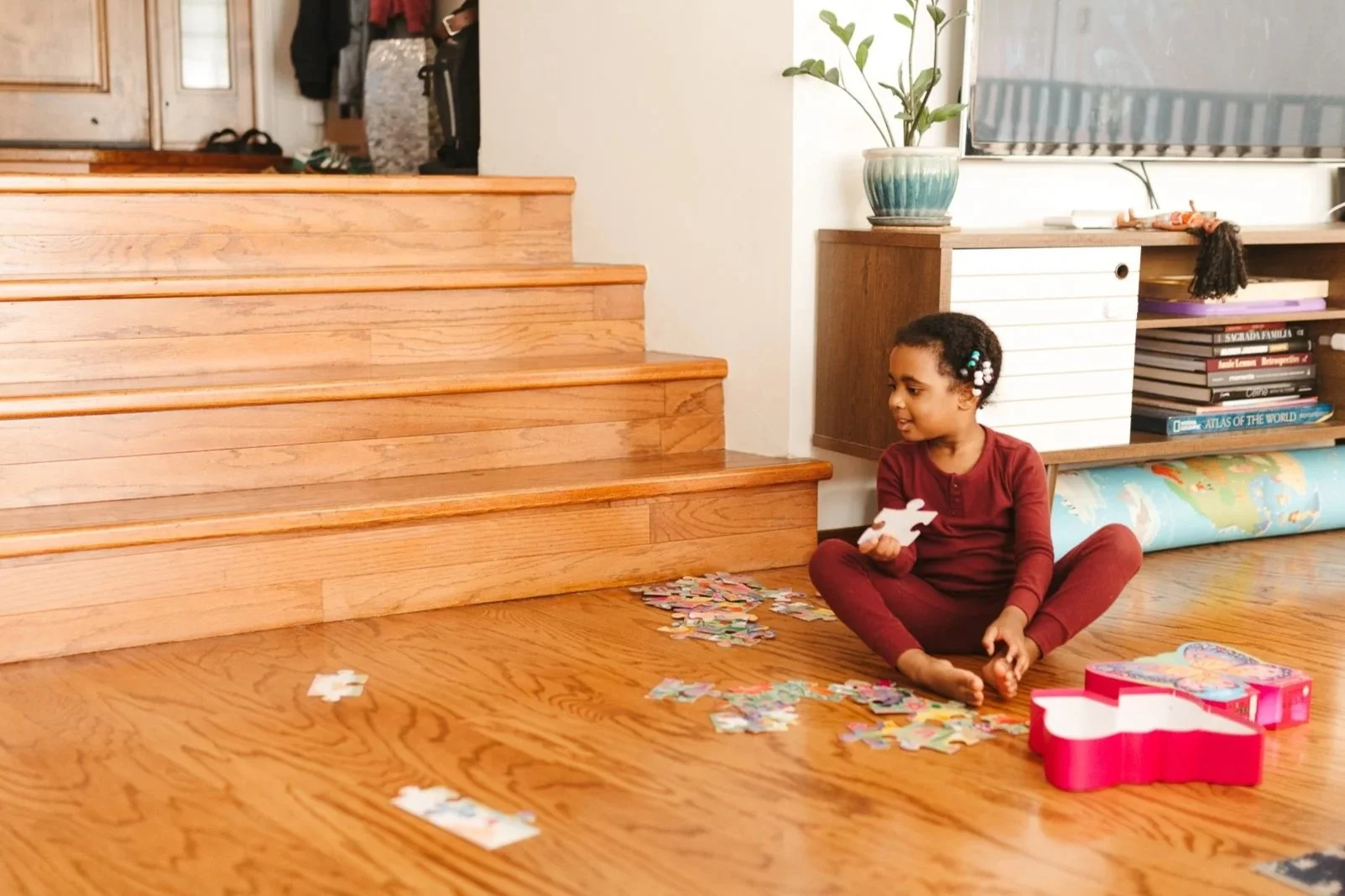 Documentary-style family photo in a cozy Los Angeles home with natural morning light.