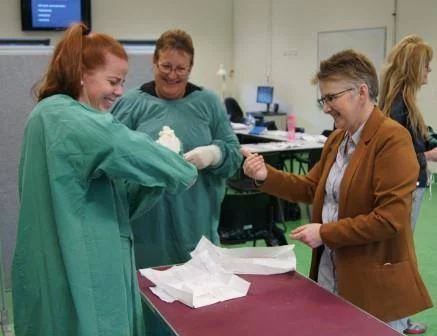 Closed glove gowning.jpg