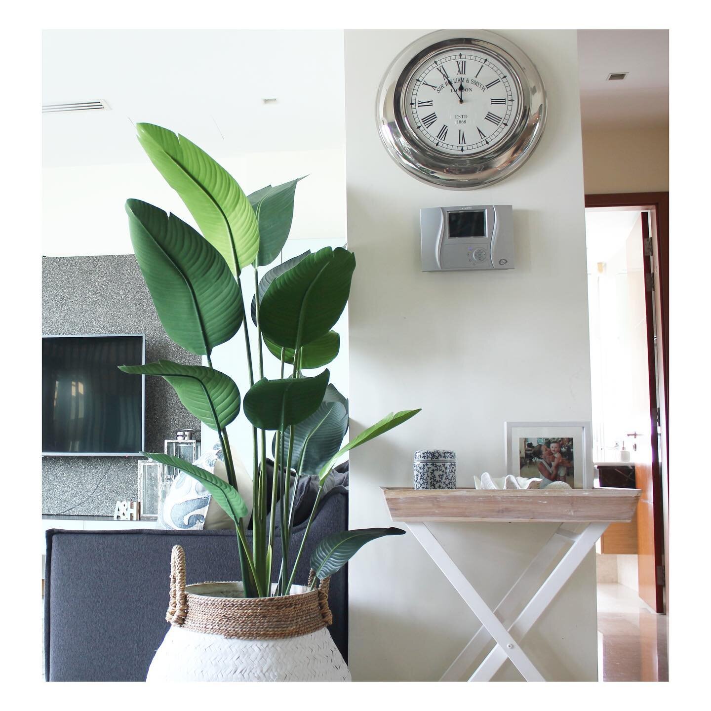 Previously this was a blank wall with just the intercom, so we added this gorgeous clock and distressed tray table with some decorative pieces to pretty up the walkway area.

📸The Berth Sentosa client&rsquo;s home. 
.
.
.
.
.
#hamptonshome
#coastald