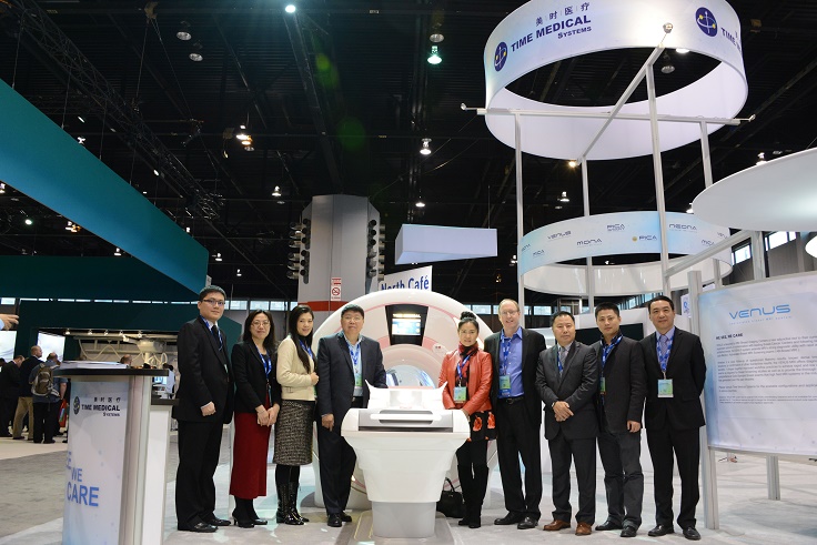 Team Time Medical Systems and Dr. Chris Comstock of Memorial Sloan-Kettering Cancer Center at RSNA 2015 in front of the AB-Breast MRI System