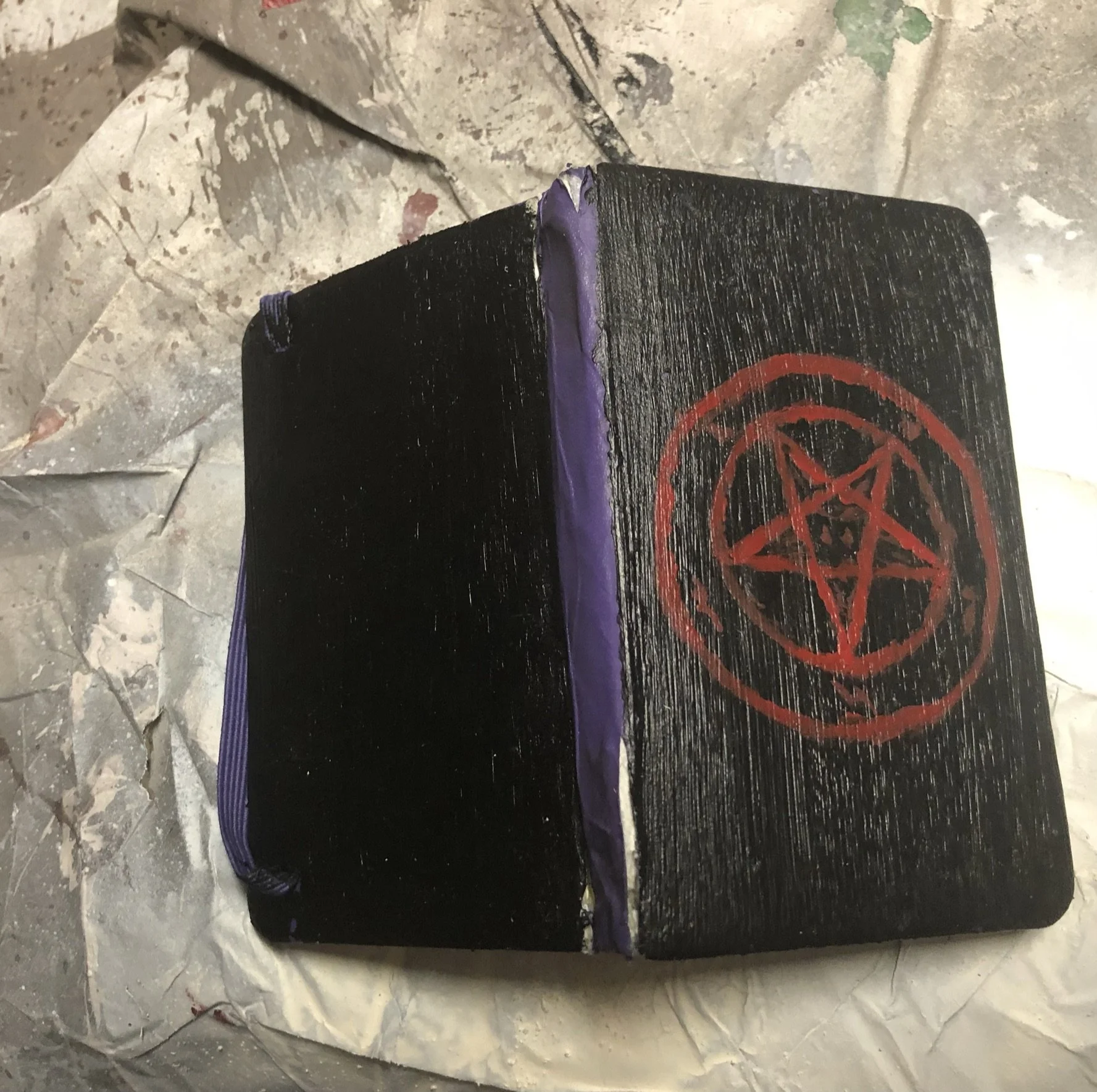  Mini Satanic Bible, with a bit of wear and tear.  