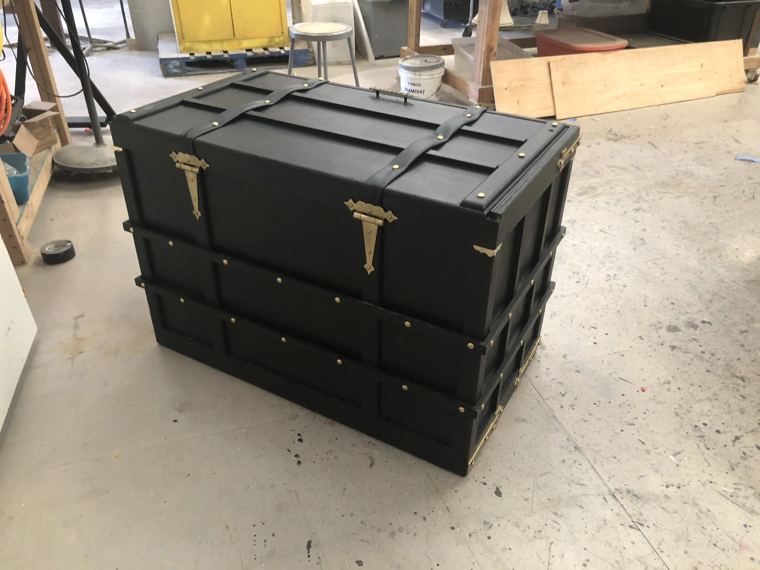  Add a handle, and staple down some leather straps. 