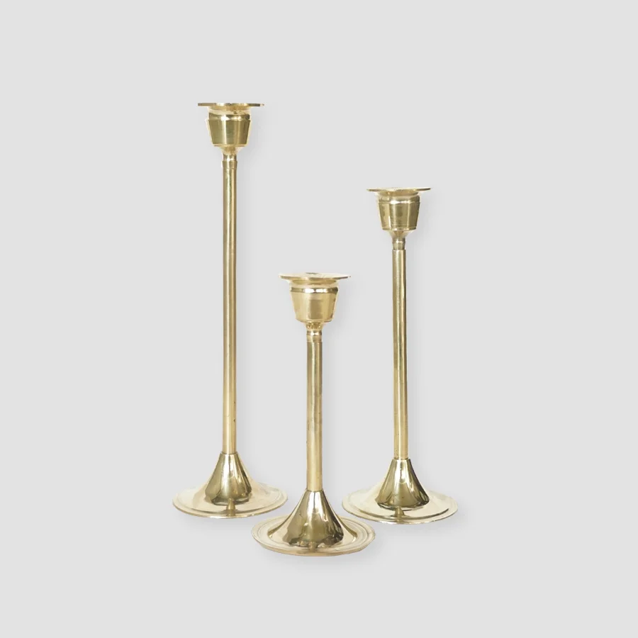 WILLHEIM CANDLESTICK HOLDER | GOLD Gold brass. Available in various sizes and comes assorted in sets of 3 pieces Size : (L) H 24.5 cm (M) 9 cm (S) H 4.5 cm IDR 37,500/per set Qty Available: 22 set