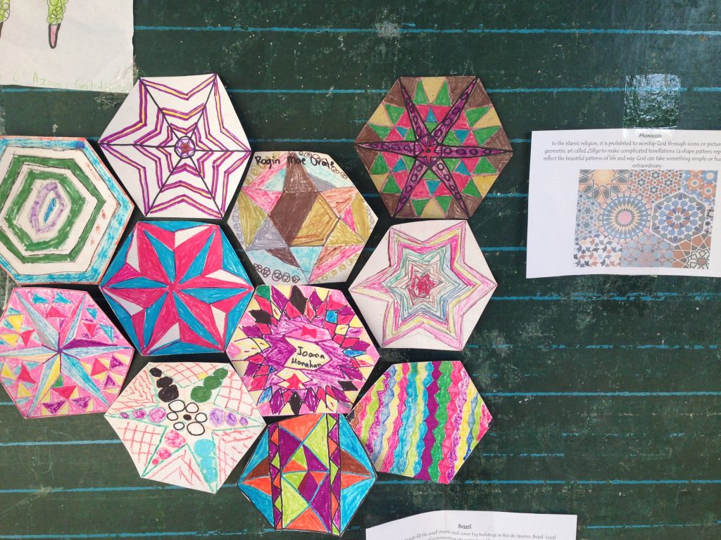 After studying tessellation in Islamic art, the divine geometry called Zellige, the 4-6 grade class made their own inspired tiles.