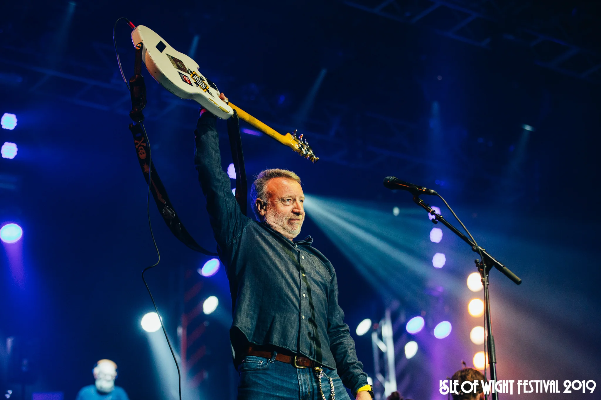 Peter Hook thanks the crowd after performing Blue Monday