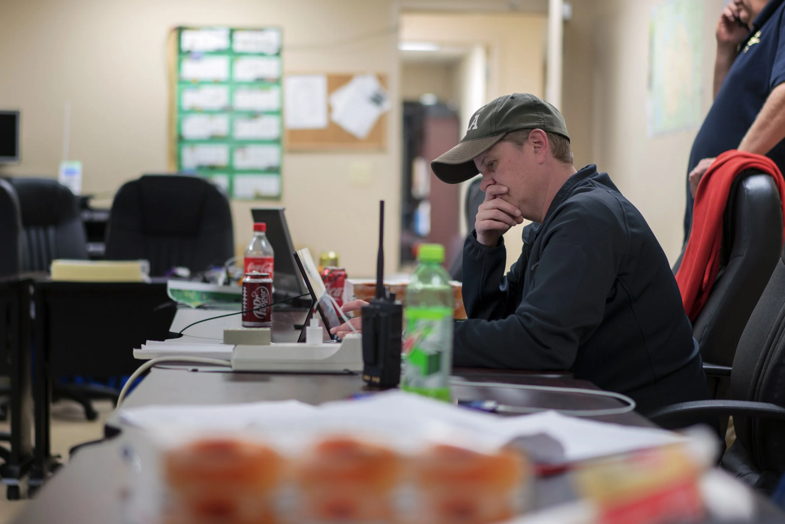 Natalie Boone, Director of Celina’s EMS and AMS, monitors incoming calls as she reflects on how to make the best use of the limited number of ambulances once the local hospital closes.
