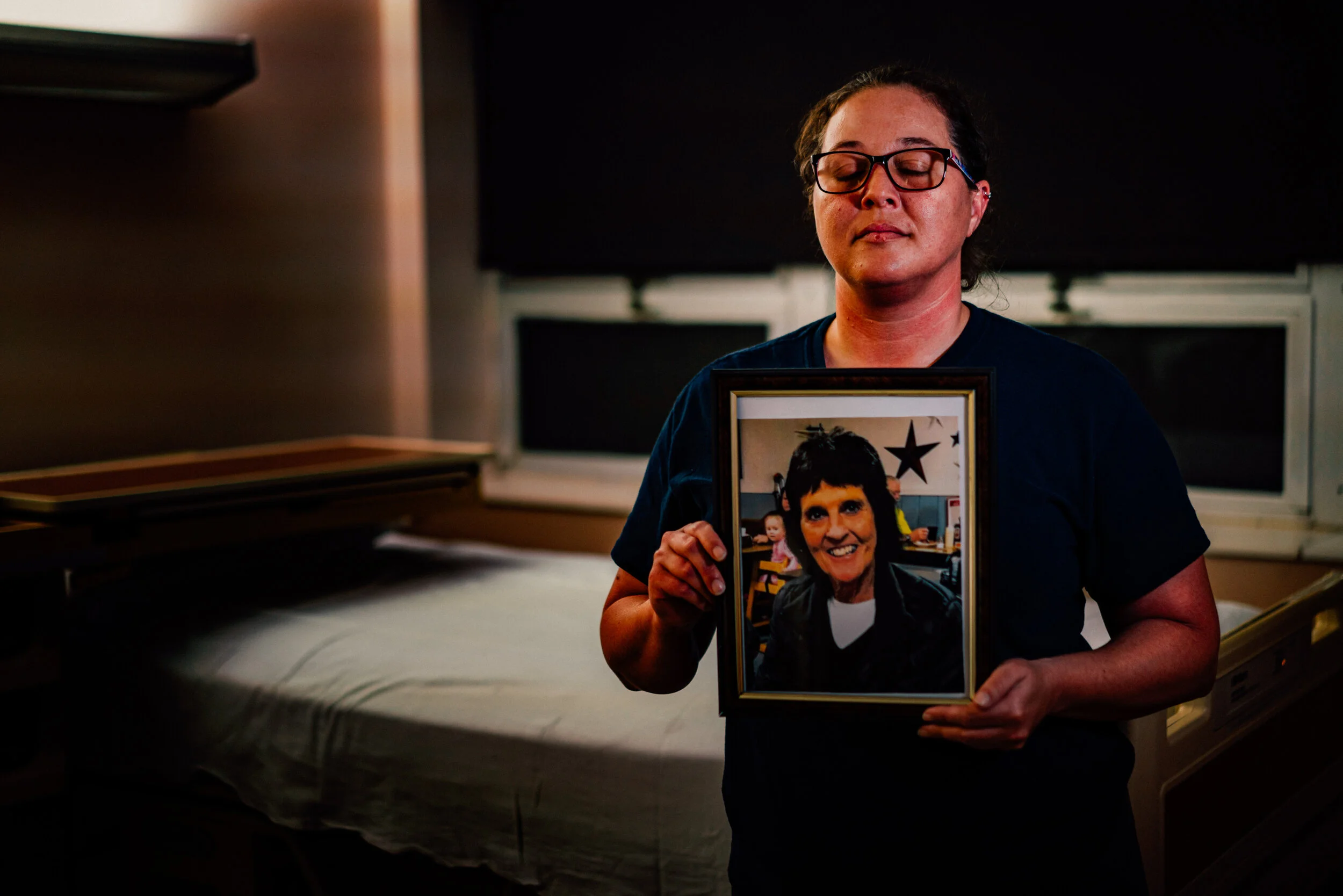 Mary holds the photograph of her co-worker, Terri, standing in front of the bed where Terri took her last breath. Mary tells me that the hosptial staff is like a family, and that Terri had even requested to be transferred to Cumberland River Hospita