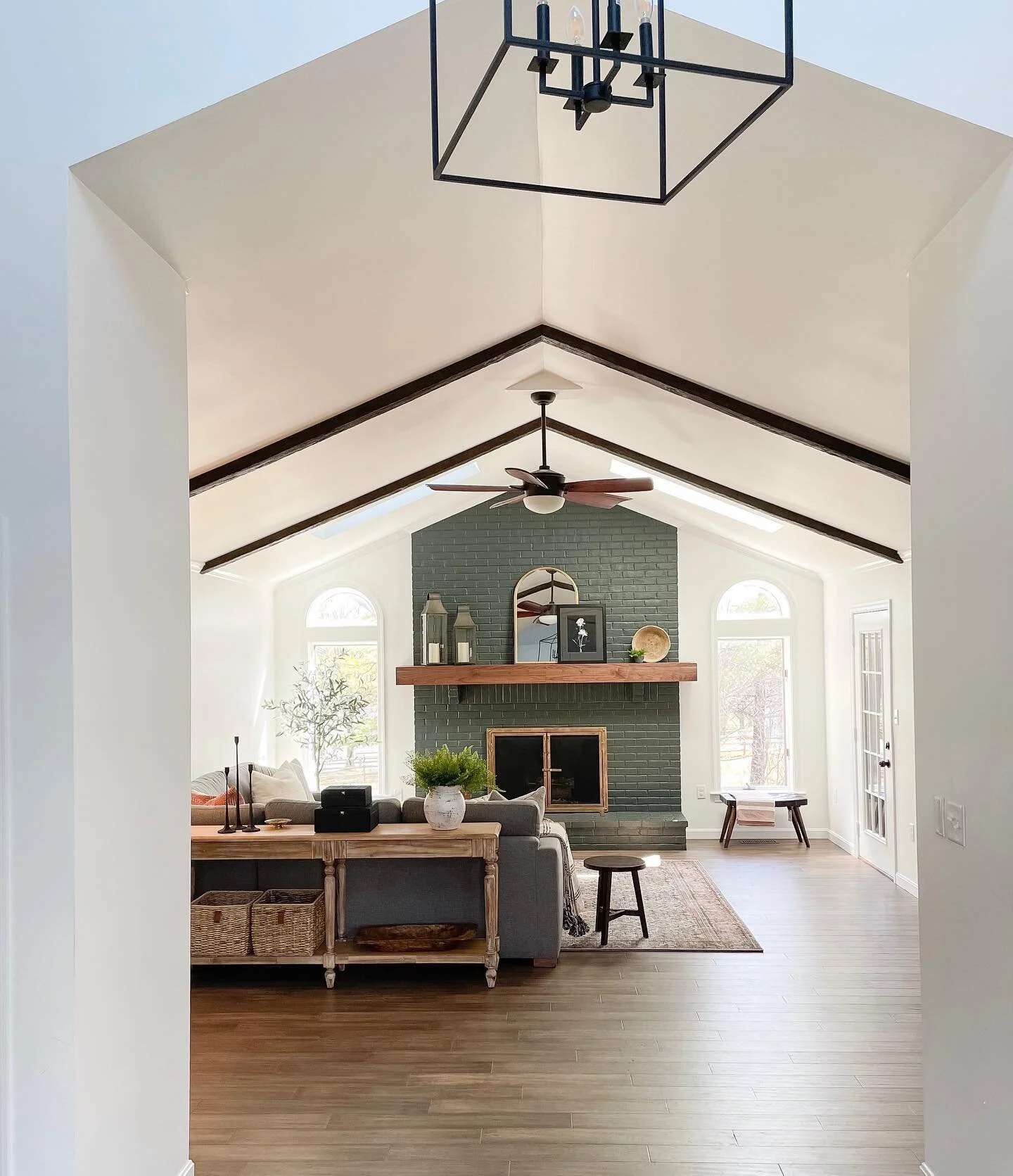 Swipe for the before of this family room for the sweetest family ❤️ Just waiting on leather chairs to come in to finish off the space
