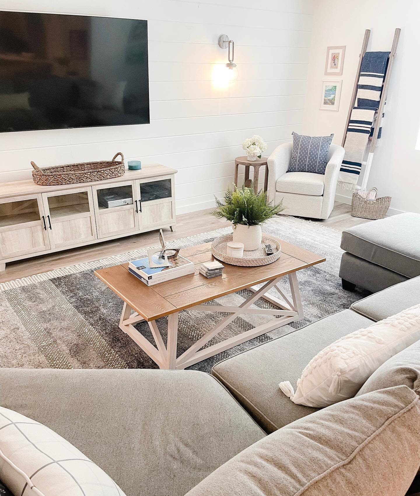 Another view of our recent coastal inspired basement project! For a refined coastal look, we love to start with neutral colors and add depth with textures and pops of blue