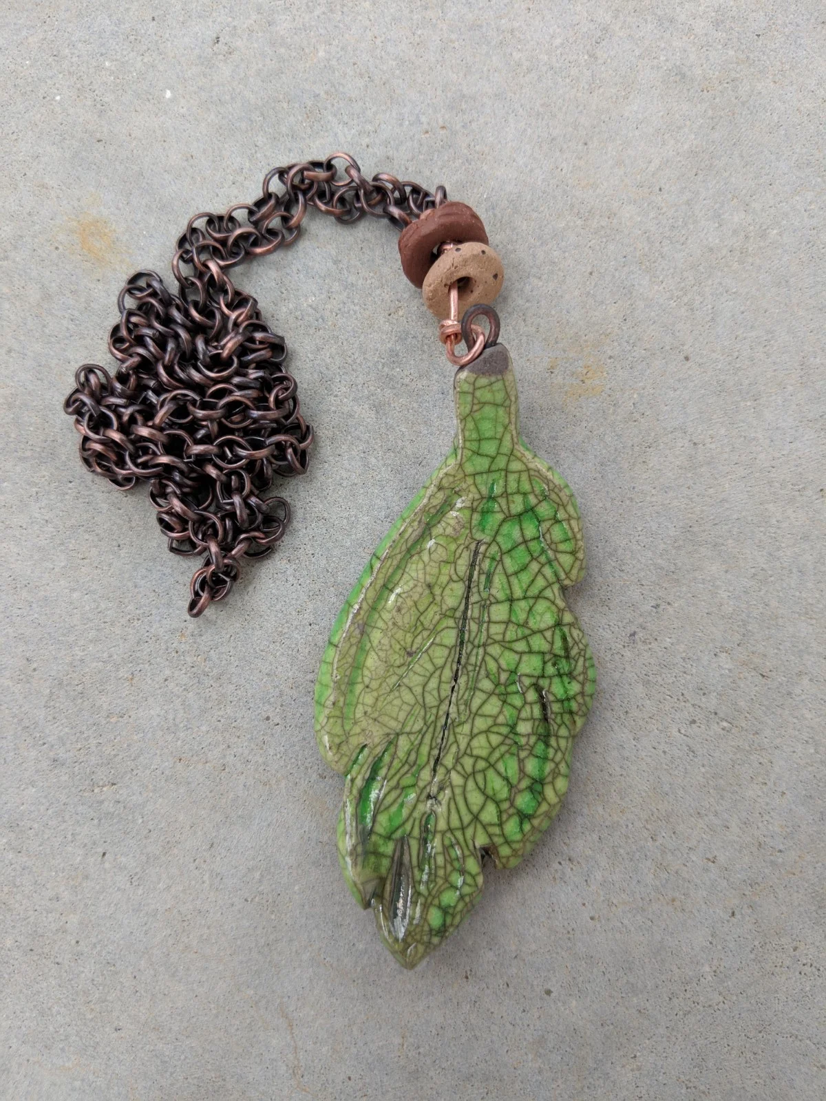 Lime green glaze leaf pendant