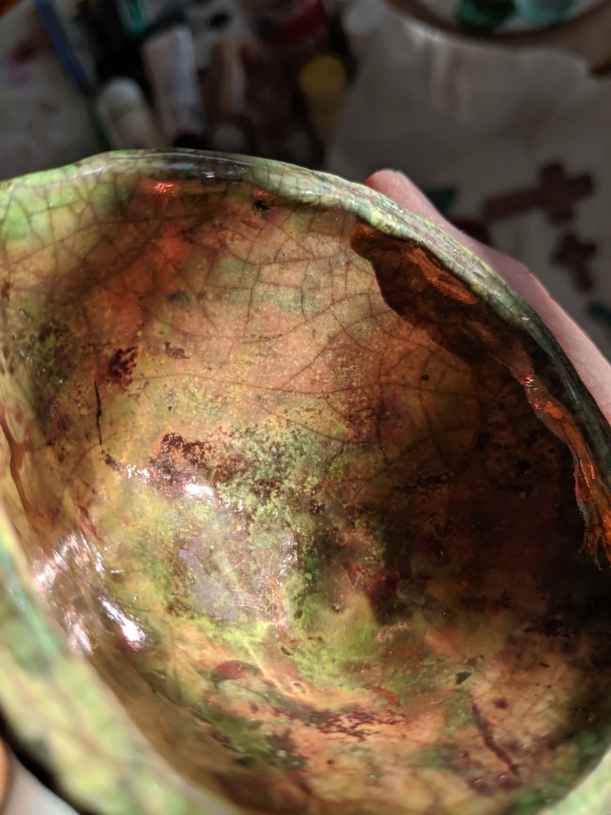 Small lime green glaze dish that was so hot it turned almost all copper.