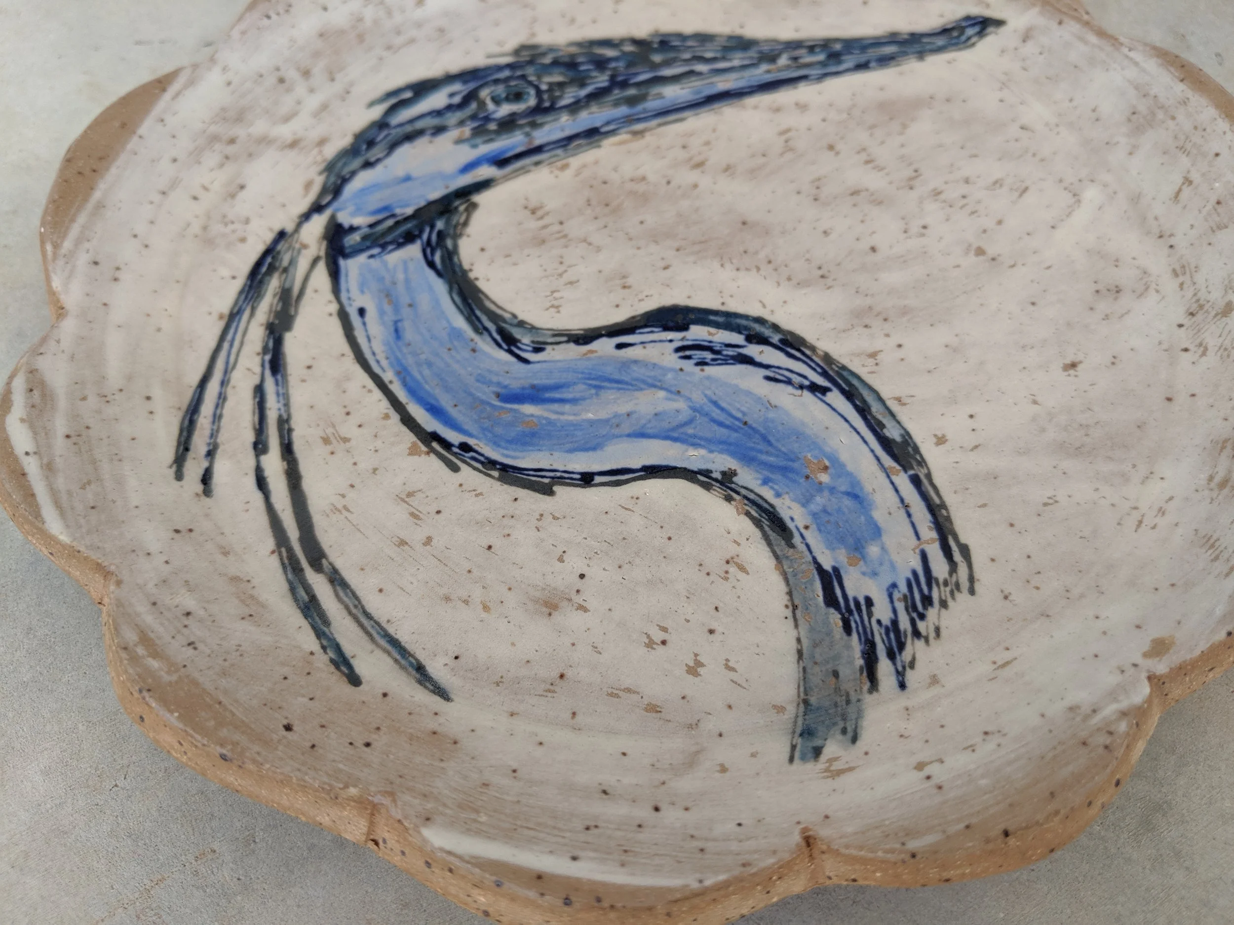 I enjoy the watercolor effect of the underglazes on this plate.