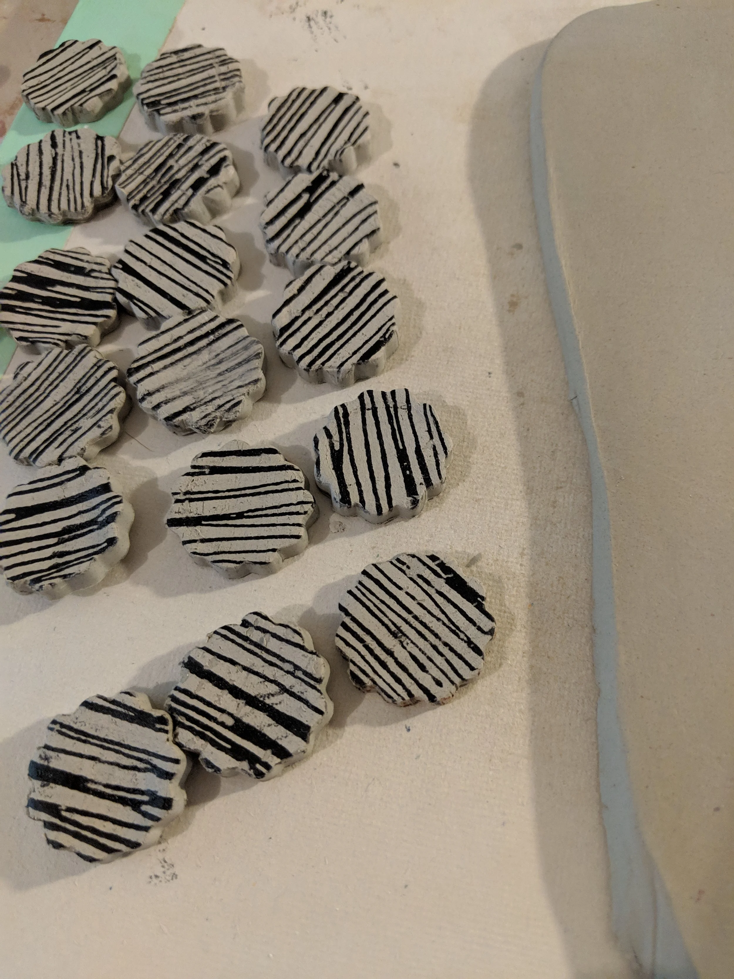Porcelain clay cut and ready for the high fire wire.