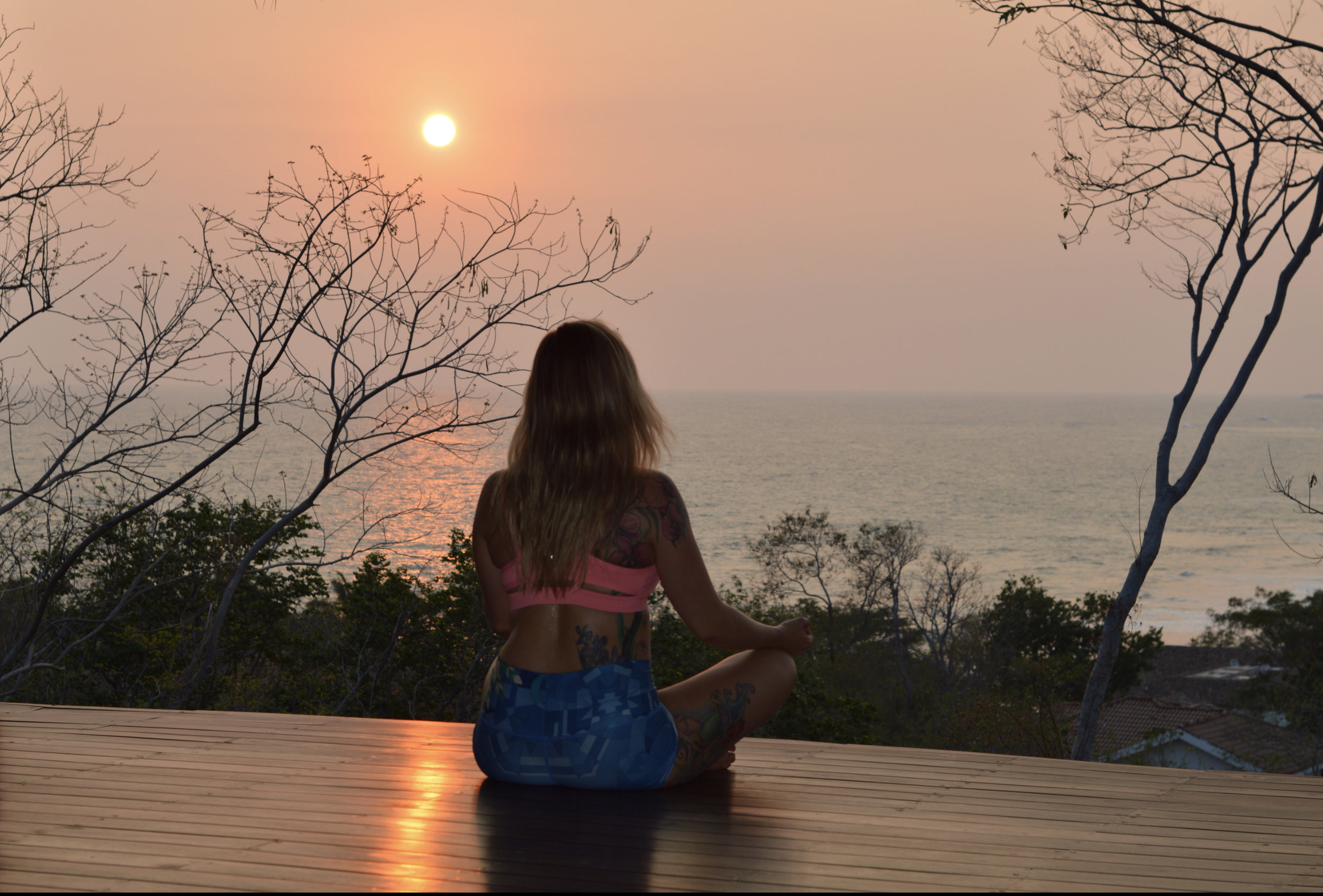 Brittany meditates while overlooking Playa Santana in Nicaragua.
