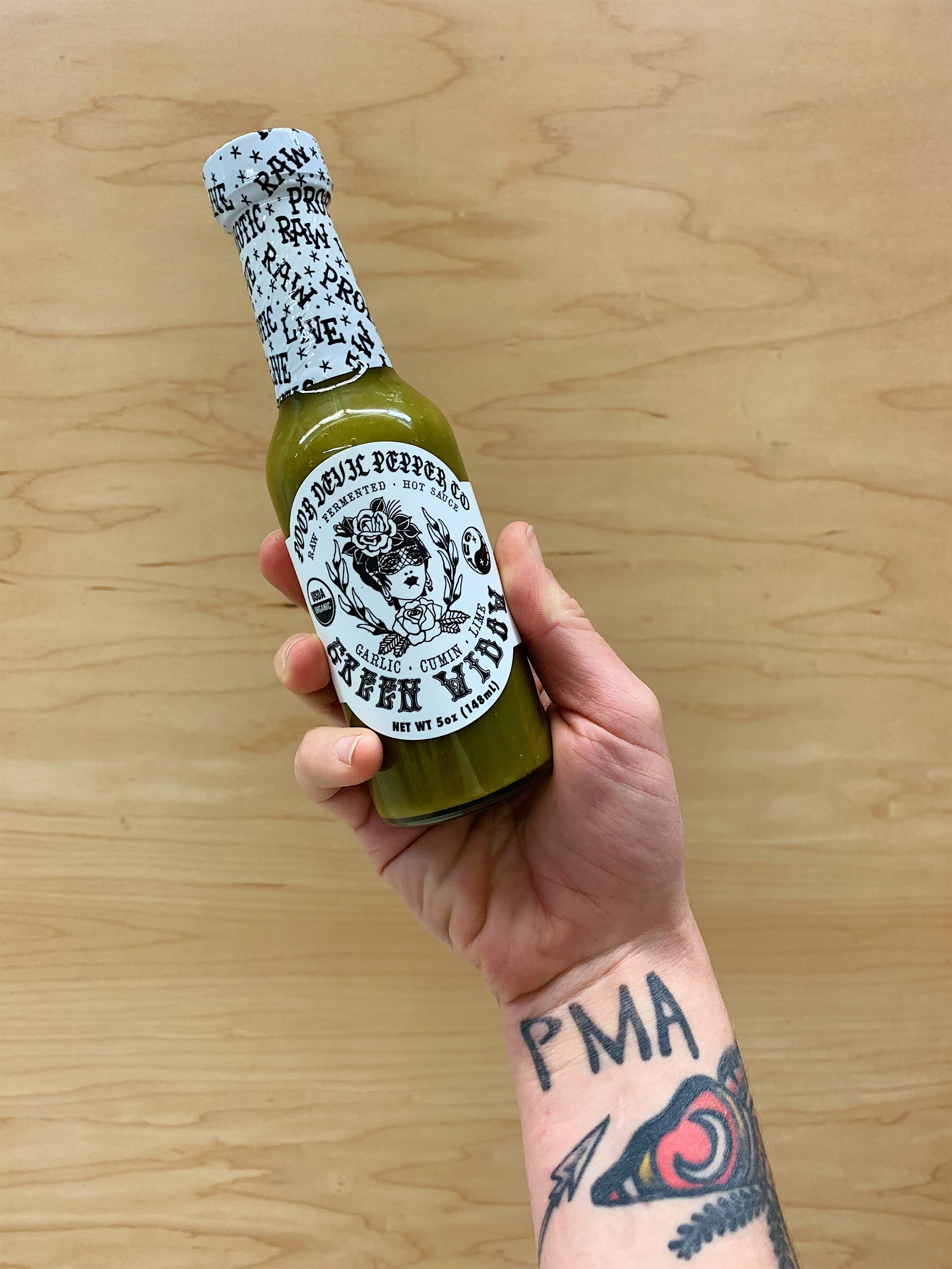 Green Widow/ A green sauce like no other. jalapenos, garlic & lime create an addictive sauce that will remind you to not sleep on the heat of jalapenos.