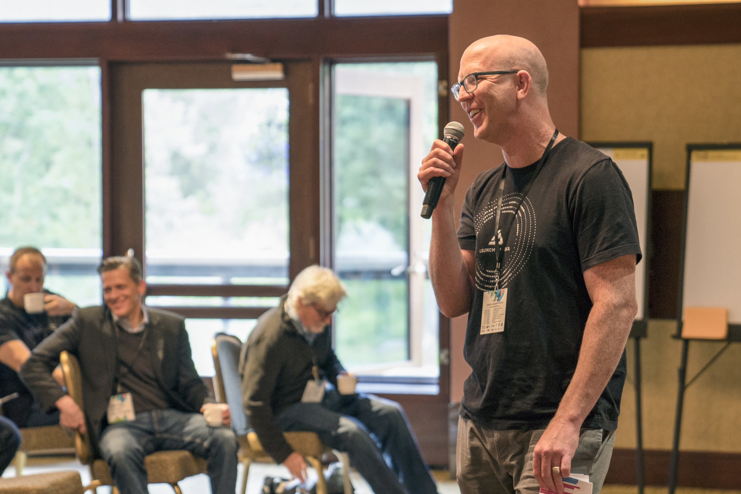 Isaac Vanderburg, managing director of Launch Alaska, speaks at the Energize Alaska Summit in Girdwood in 2018. (Photo courtesy of Launch Alaska)