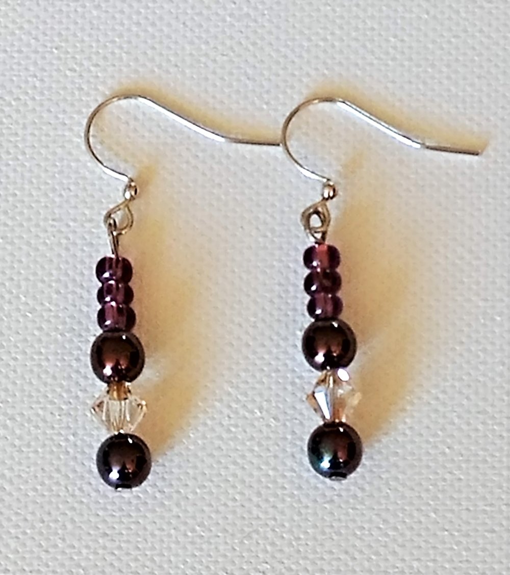 Glassed beaded earrings topped with a crystal