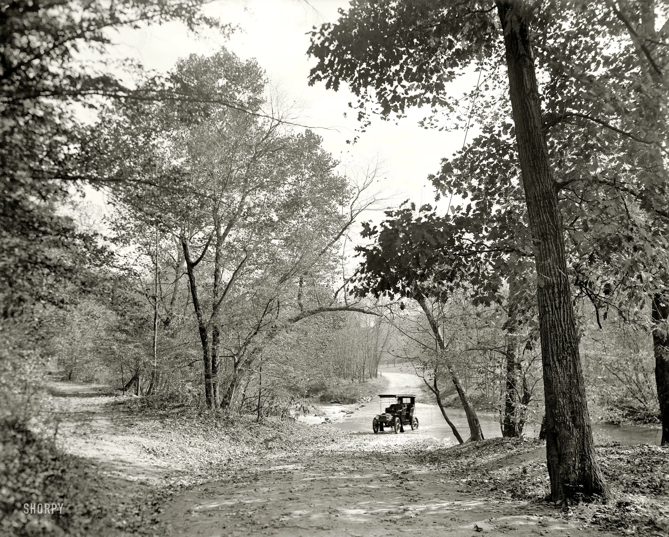 Before construction of the Zoo tunnel, motorists crossed Rock Creek at shallow fords as seen here in 1906. Detroit Publishing Company /Public Domain