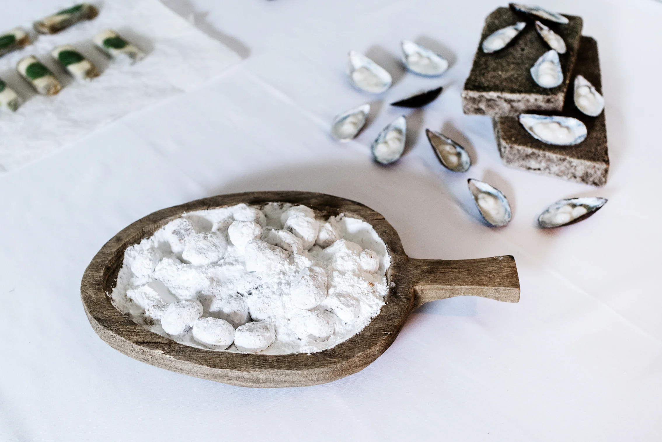 White Mussel Shells with Coconut & Lime Tapioca, and Almond Cookies surrounded by Snow. Sapour Somnia, 2017. Edible installation in collaboration with Maya Merhi. The Dream Society group show at Salong Odengatan, Stockholm. Photo by Ari Luostarinen.