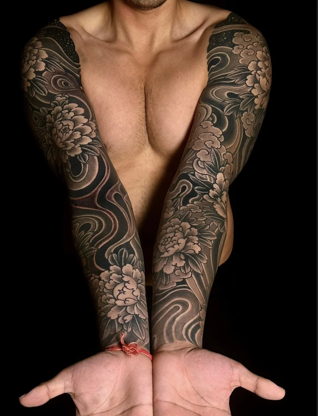 Suminagashi inspired Japanese arm sleeve tattoo with Peony