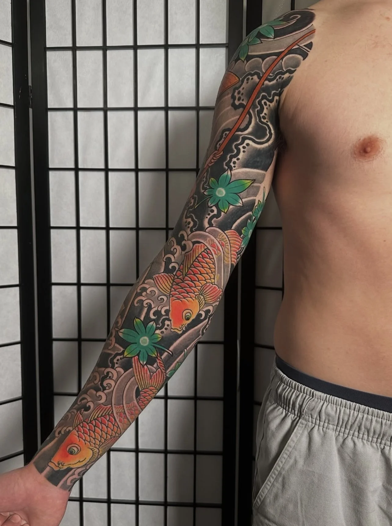 Japanese arm sleeve tattoo with fisherman and koi 2