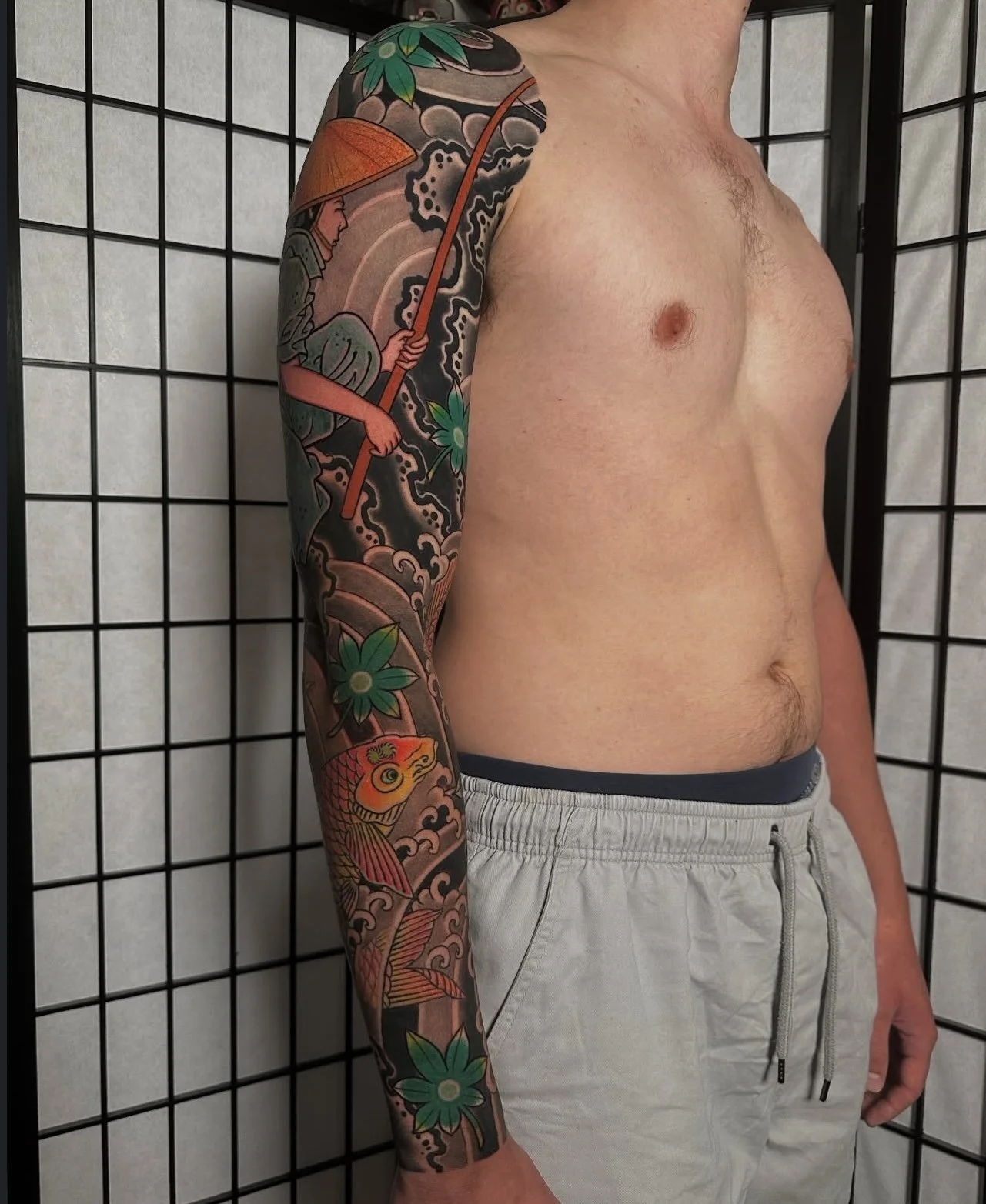 Japanese arm sleeve tattoo with fisherman and koi 3