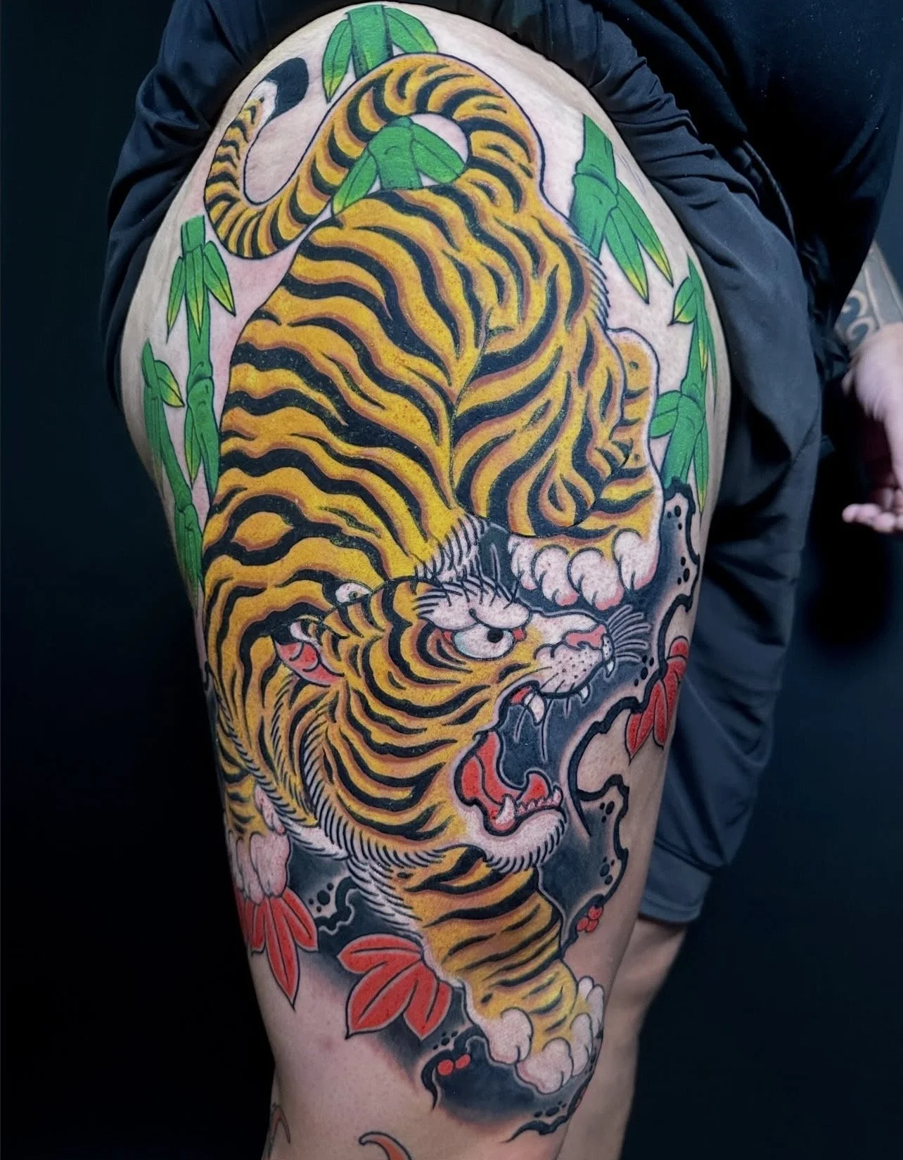 Japanese tiger thigh tattoo by TomTom at Sunset Tattoo in Auckland, New Zealand