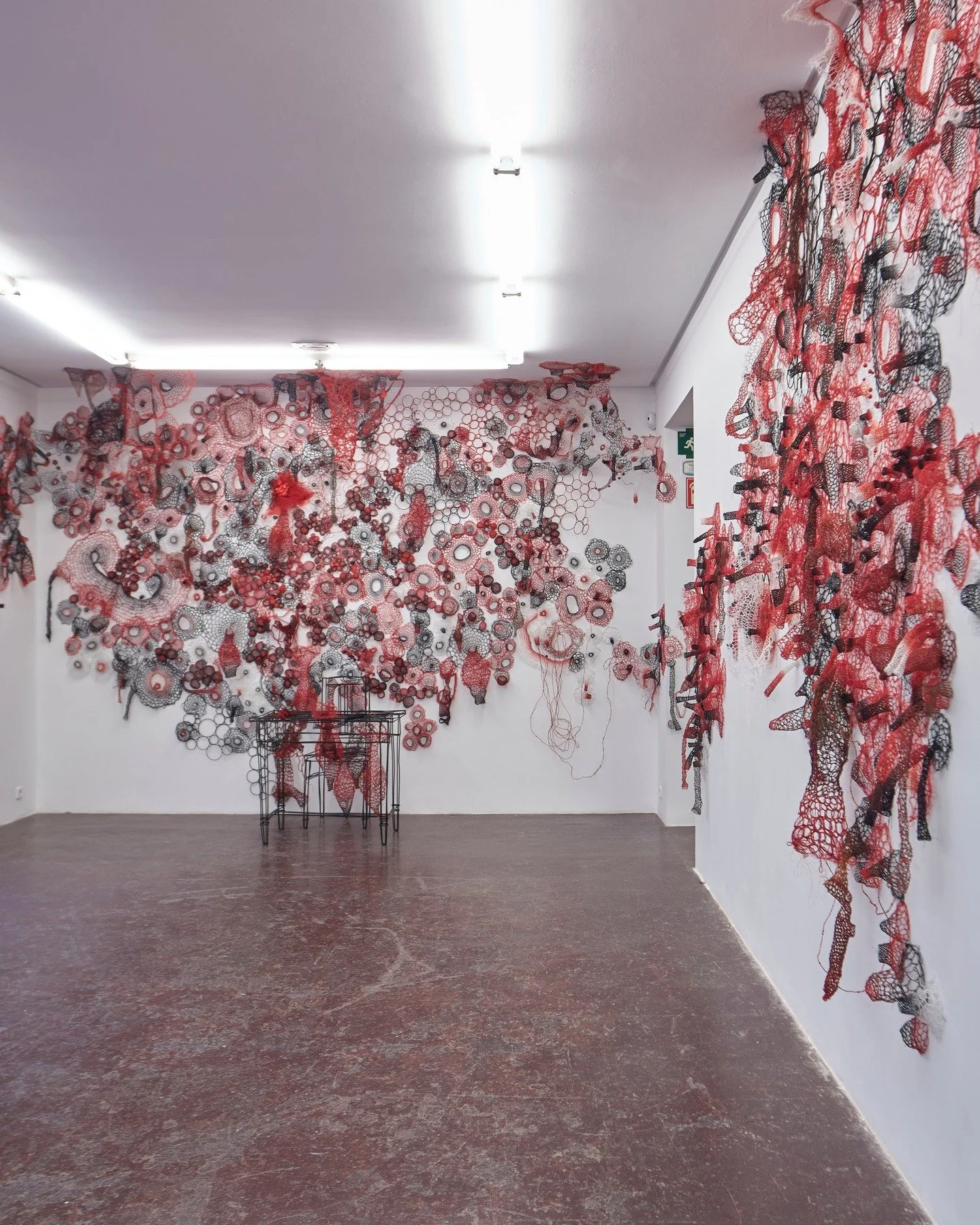 I imagine a person sitting at the table, writing or sketching. Their thoughts and feelings spilling out of their head, spreading from the table, moving up the wall, their imagination has no limits, forming a landscape of emotions that connects their 