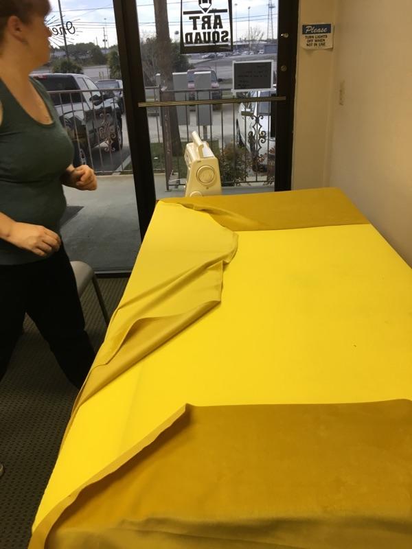  Draping the large bottom cushion. 