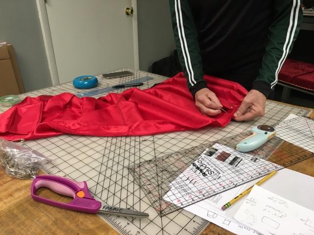  Pleating the skirt for the bench. 