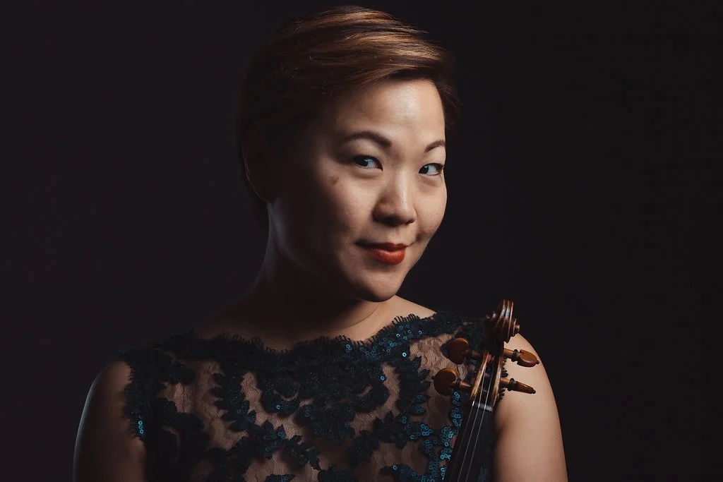 Sandy Choi Praised by the Washington Post for her “assured, sinuous solos,” violinist Sandy Choi has performed with a wide range of professional ensembles in some of the world’s greatest concert halls. In the Washington area alone, she can frequently be seen performing with ensembles including the Wolf Trap Orchestra, Alexandria Symphony Orchestra, Washington Concert Opera Orchestra, Urban Arias, Inscape Chamber Orchestra, and Balance Campaign, and has previously performed with Boston Modern Orchestra Project, Emmanuel Music, the Southwest Florida Symphony, and the Santa Barbara Symphony. Comfortable in many genres, she has shared the stage with artists including virtuoso violinist Rachel Barton Pine, indie rock artist Laura Tsaggaris, beloved singer Andrea Bocelli, and jazz legend Diana Krall. Over the years, she has had the privilege to perform in Carnegie Hall, the Kennedy Center, Orchestra Hall (Chicago), Symphony Hall (Boston), Birmingham Symphony Hall (UK), and the Teatro Communale di Firenze (Italy).