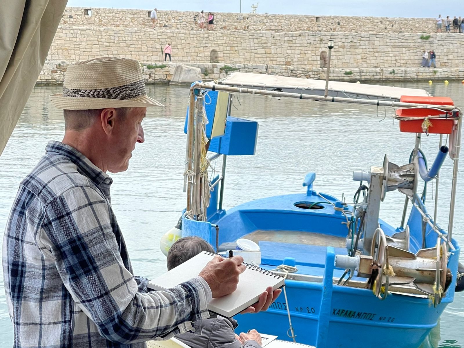 Painting the traditional boats in Rethymno, Crete