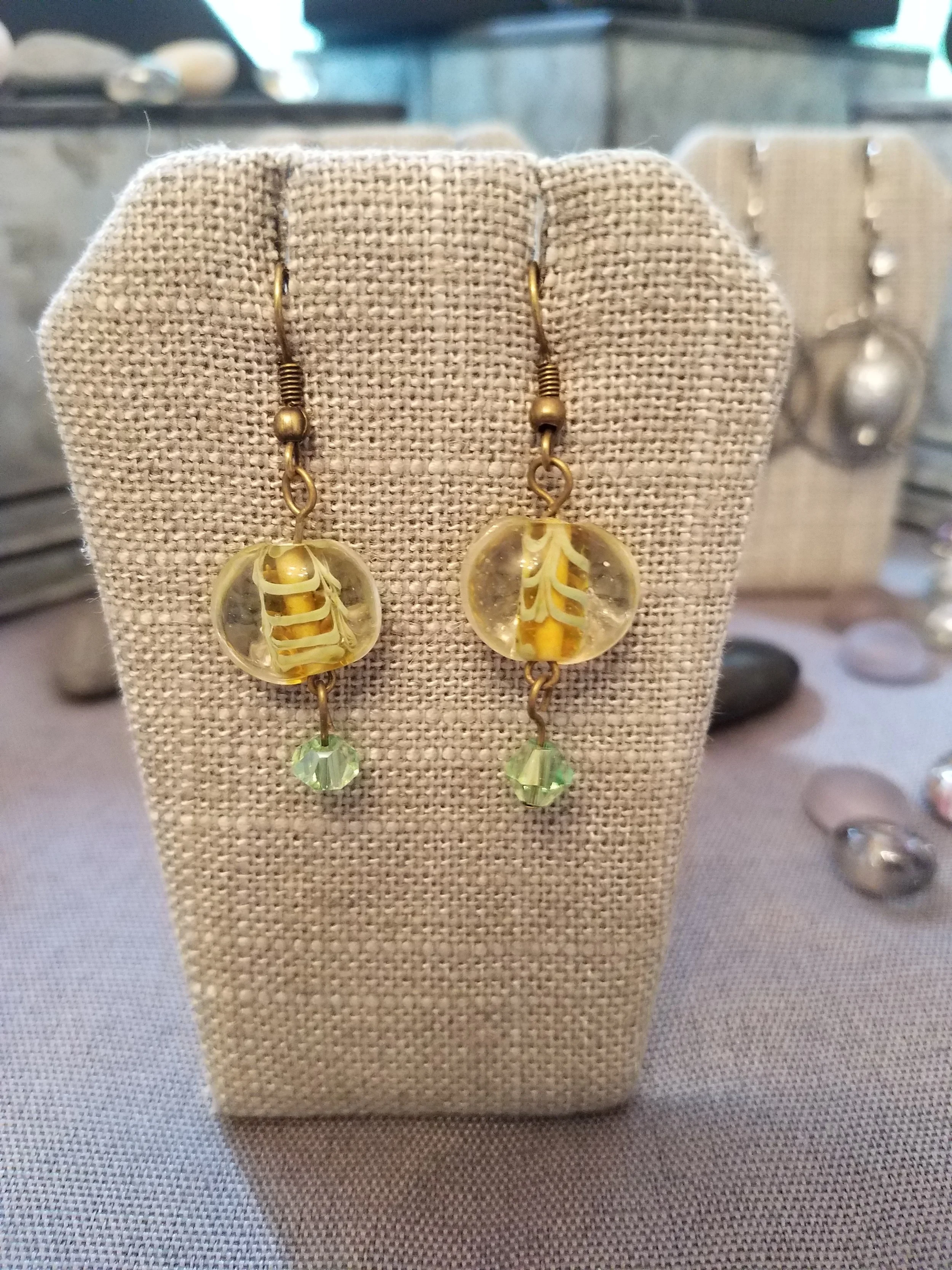 Millefiori glass bead and green crystal