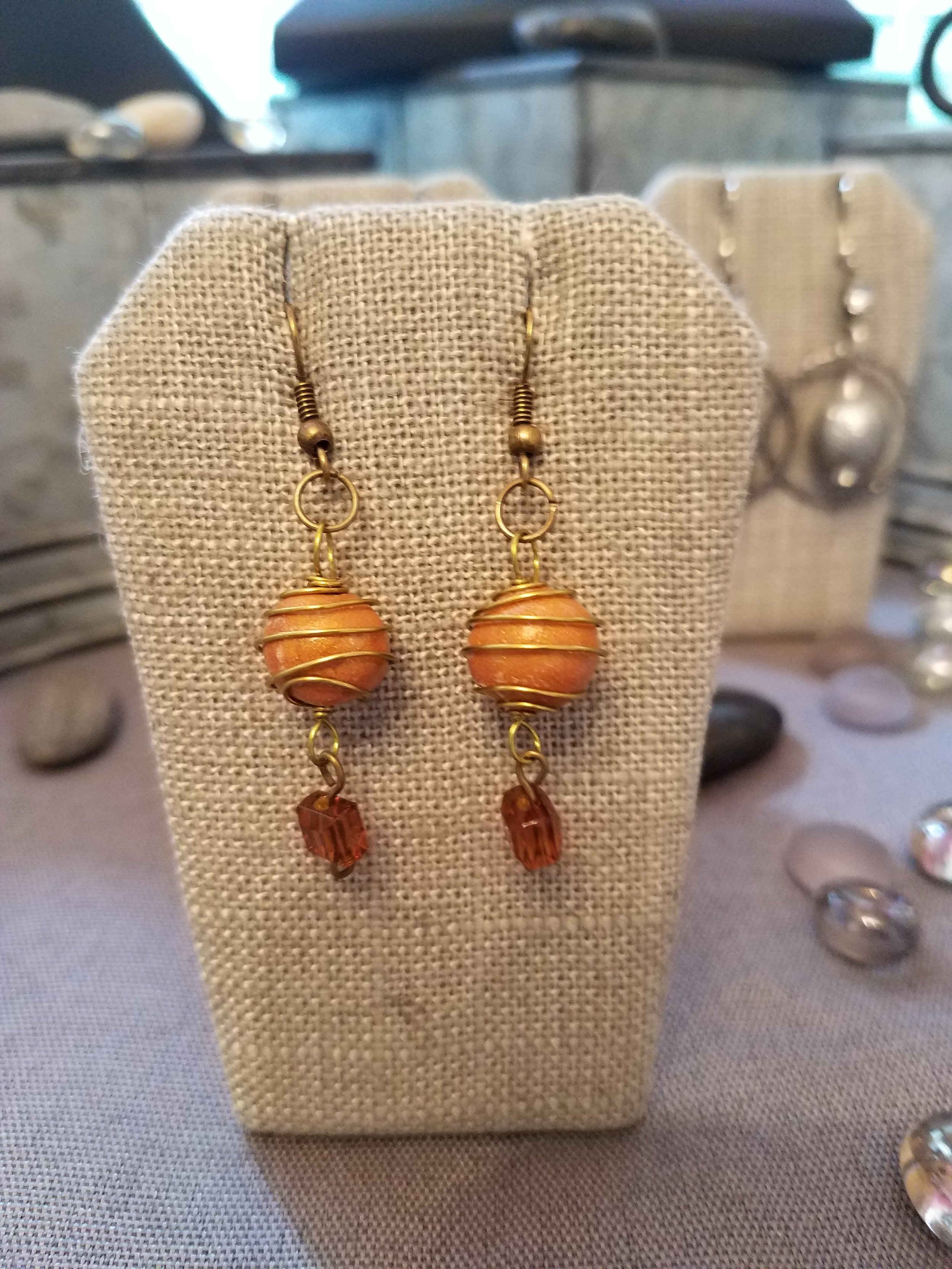 Gold polymer clay bead with peach square crystal