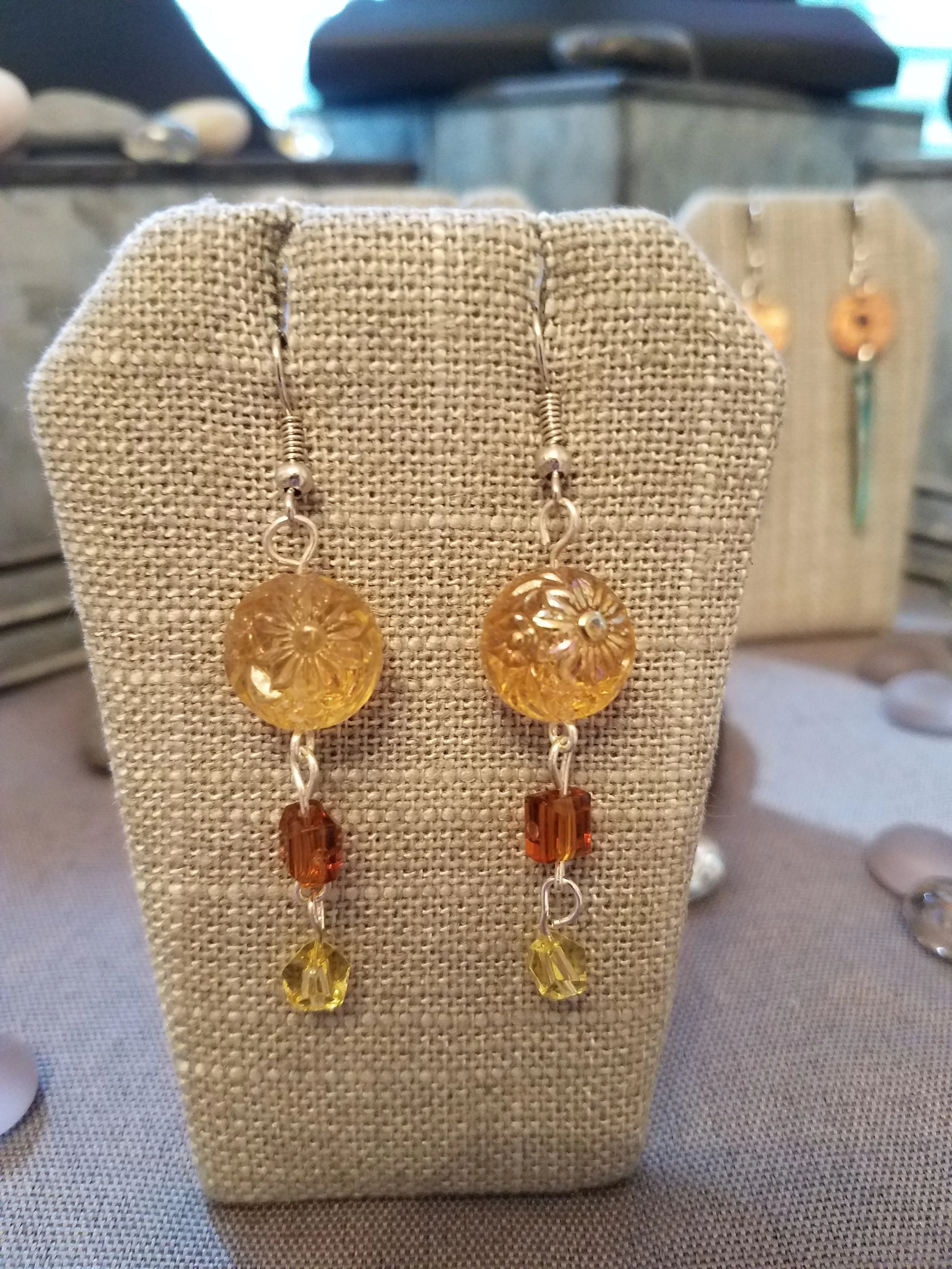 Gold flower bead with orange and yellow beads