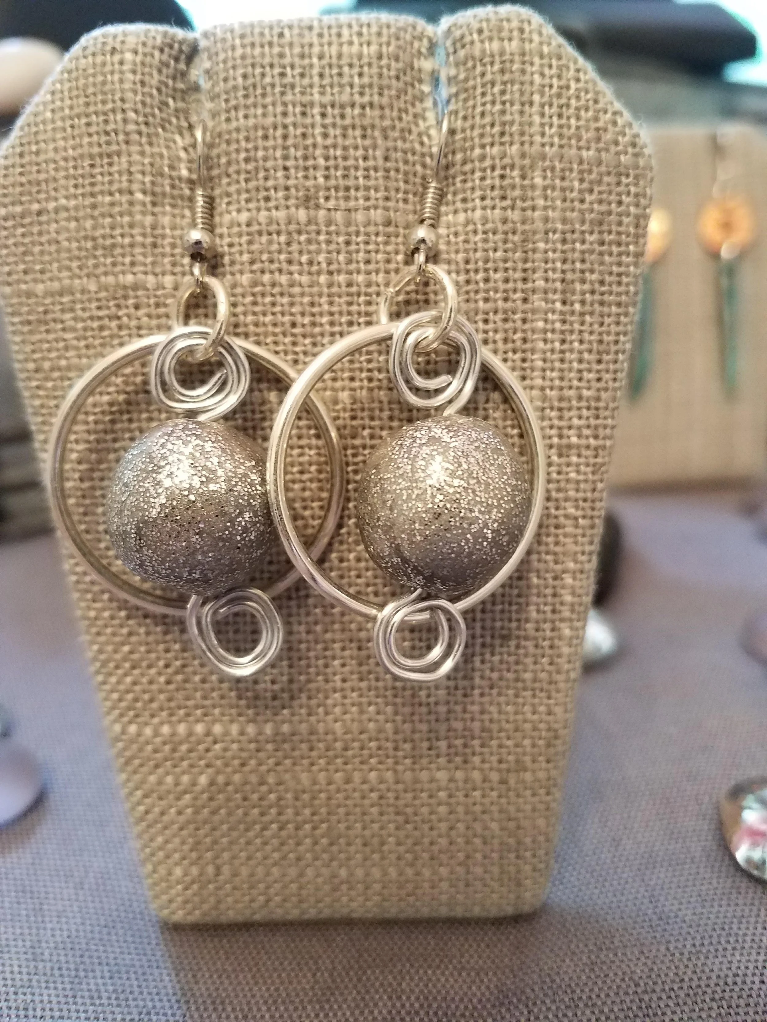 Silver sparkle paper mache beads with silver curls 