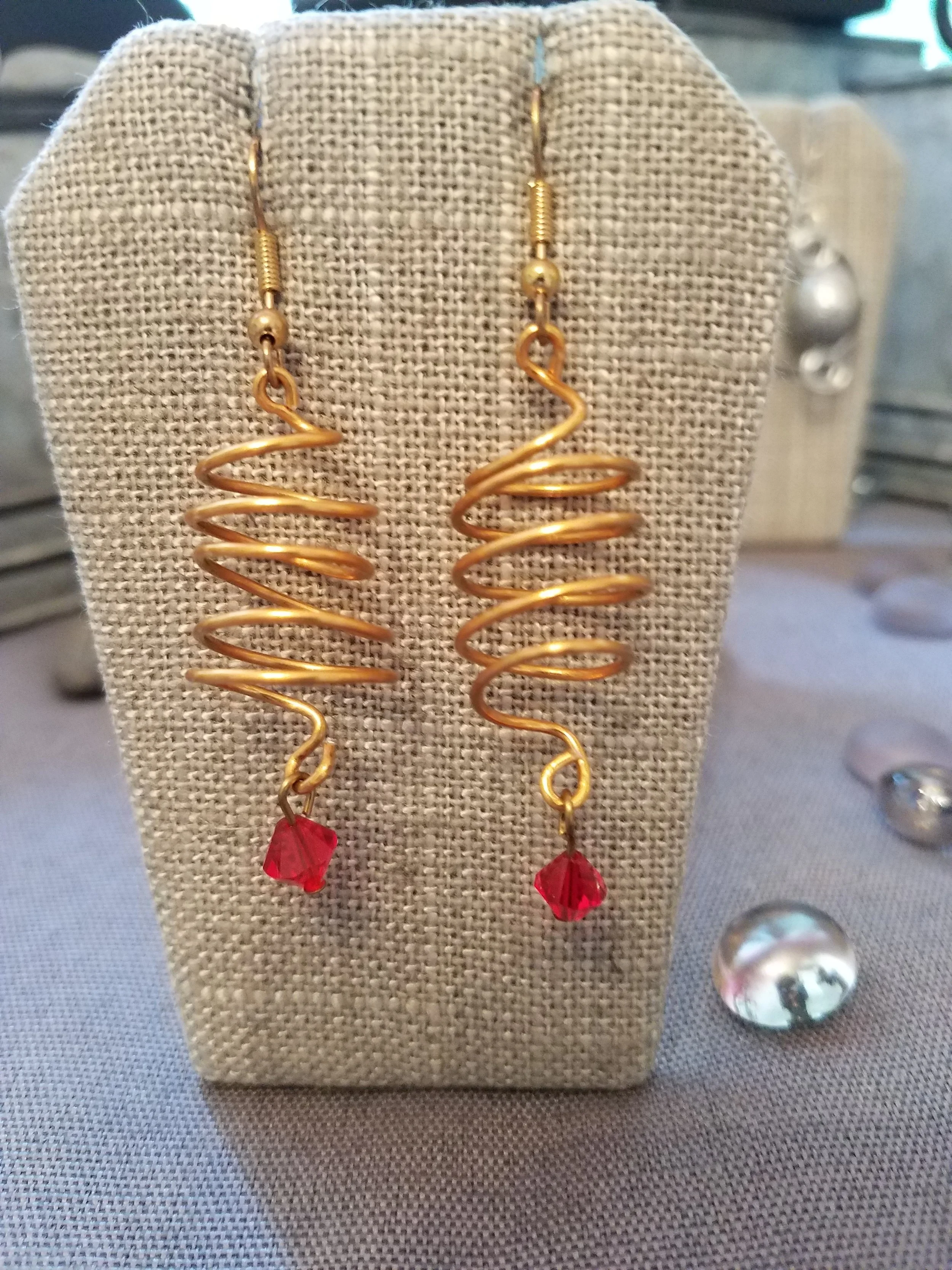 Copper corkscrew and red crystal