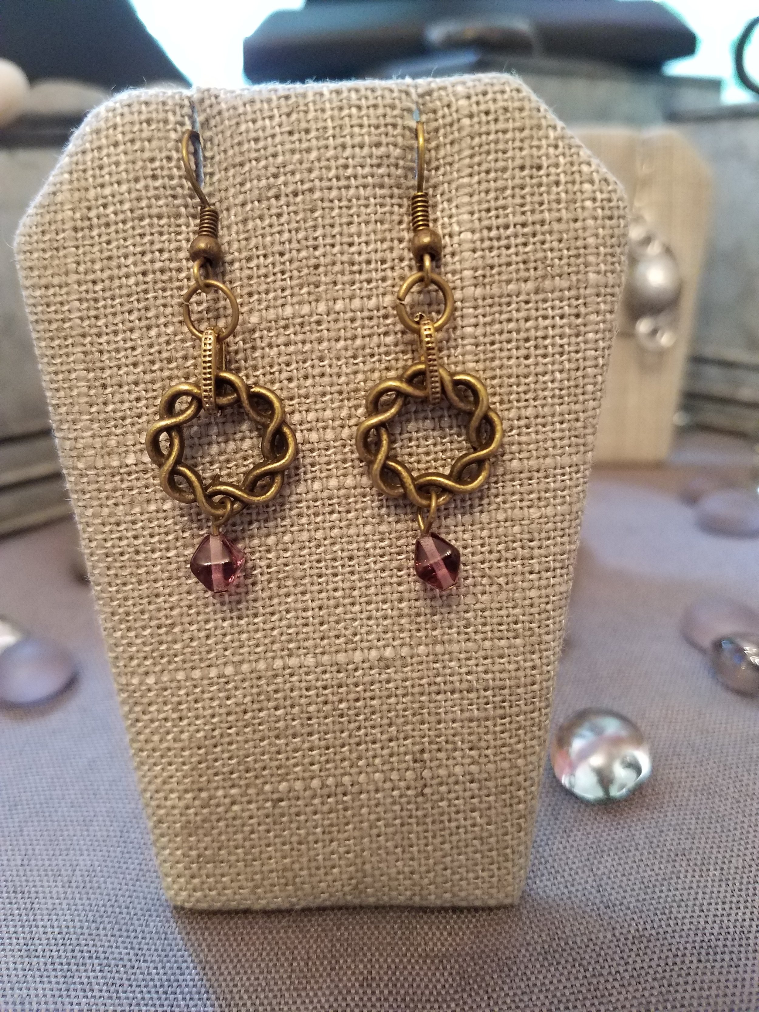 Antique gold braided wreath and purple crystal