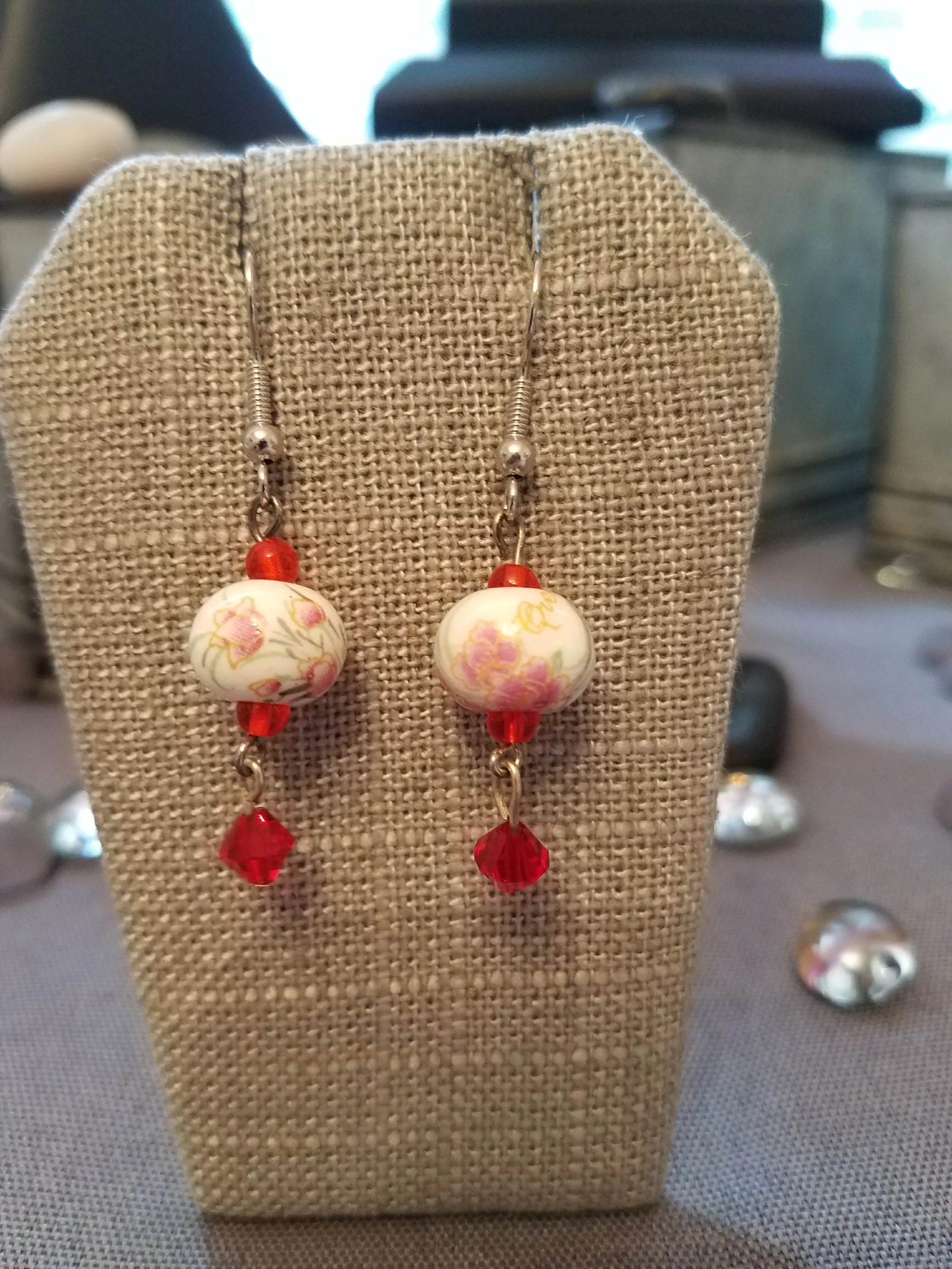 Painted ceramic beads and red crystals