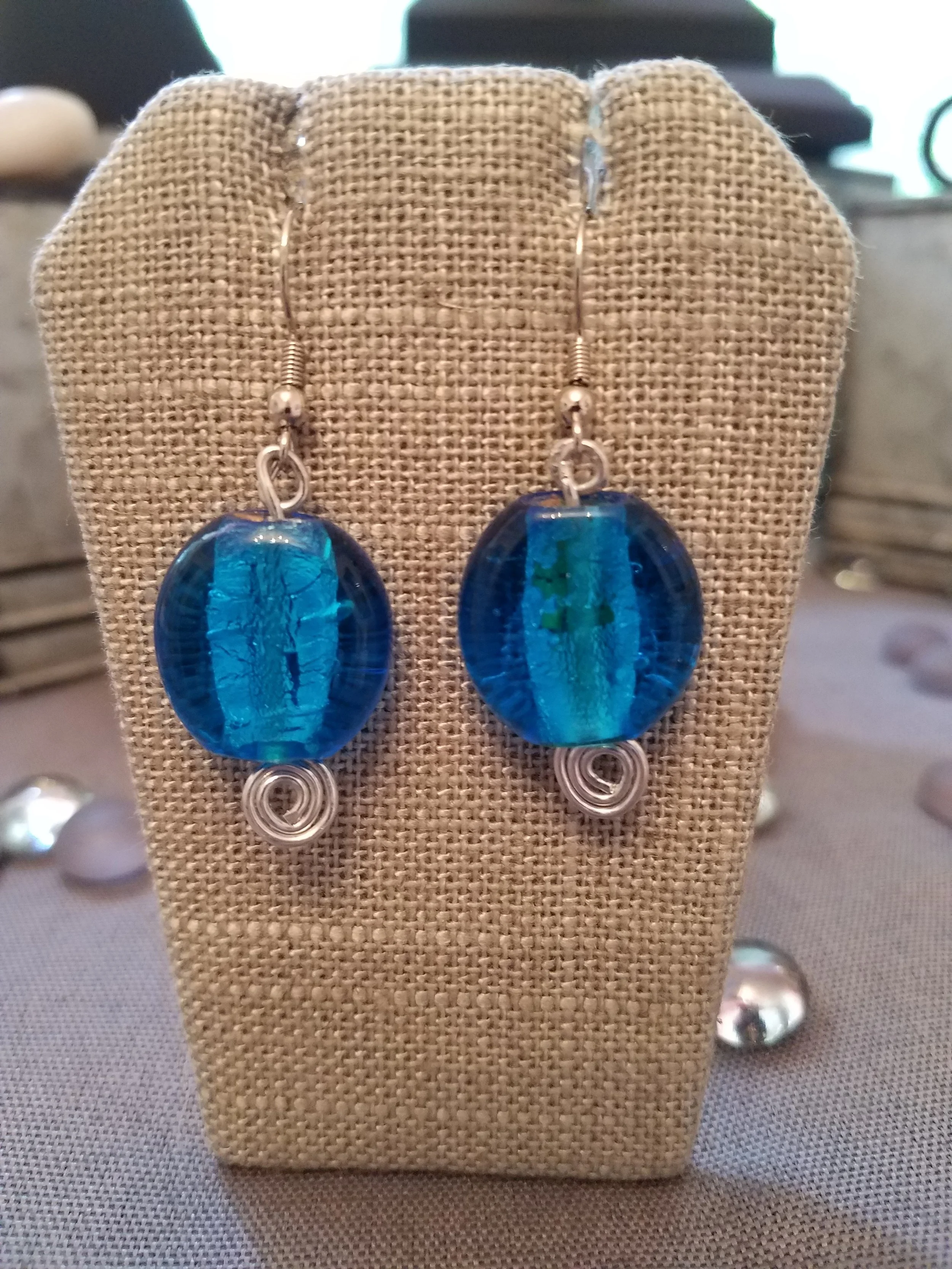 Small blue foil murano glass beads and silver curls 