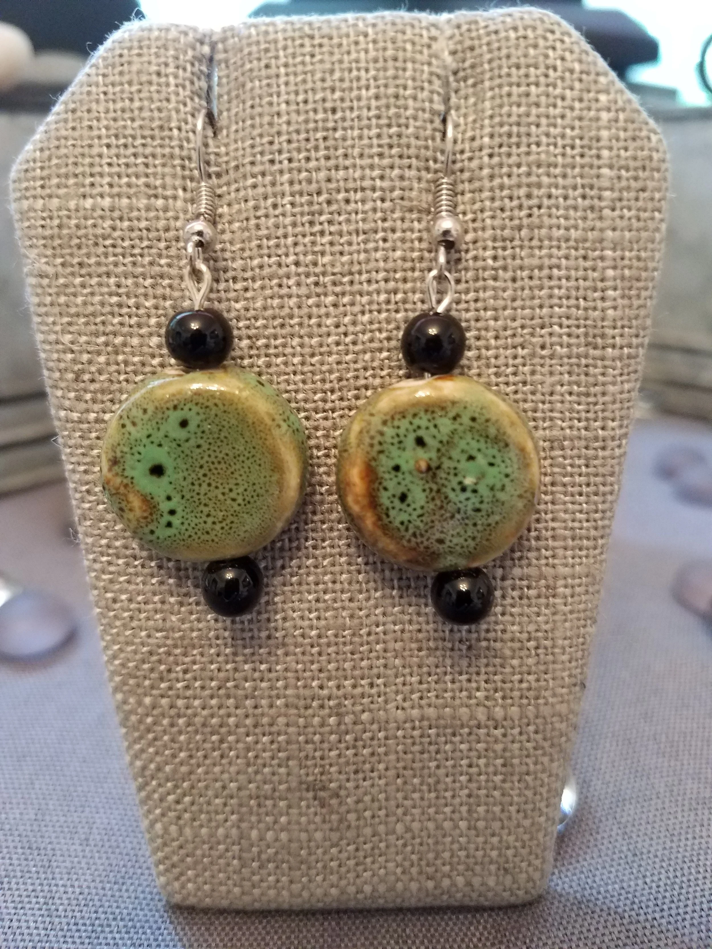 Green ceramic bead and black glass beads