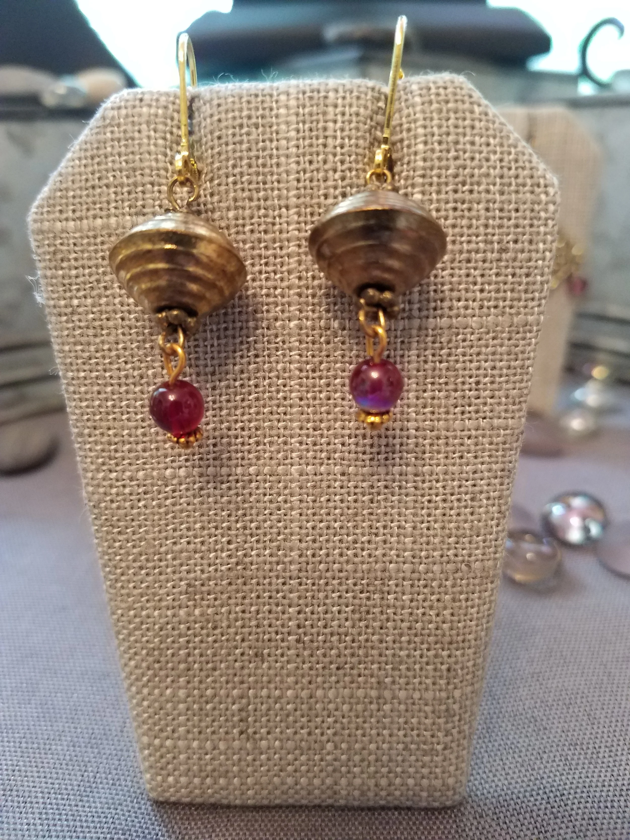 Antique gold bicone with garnet color bead
