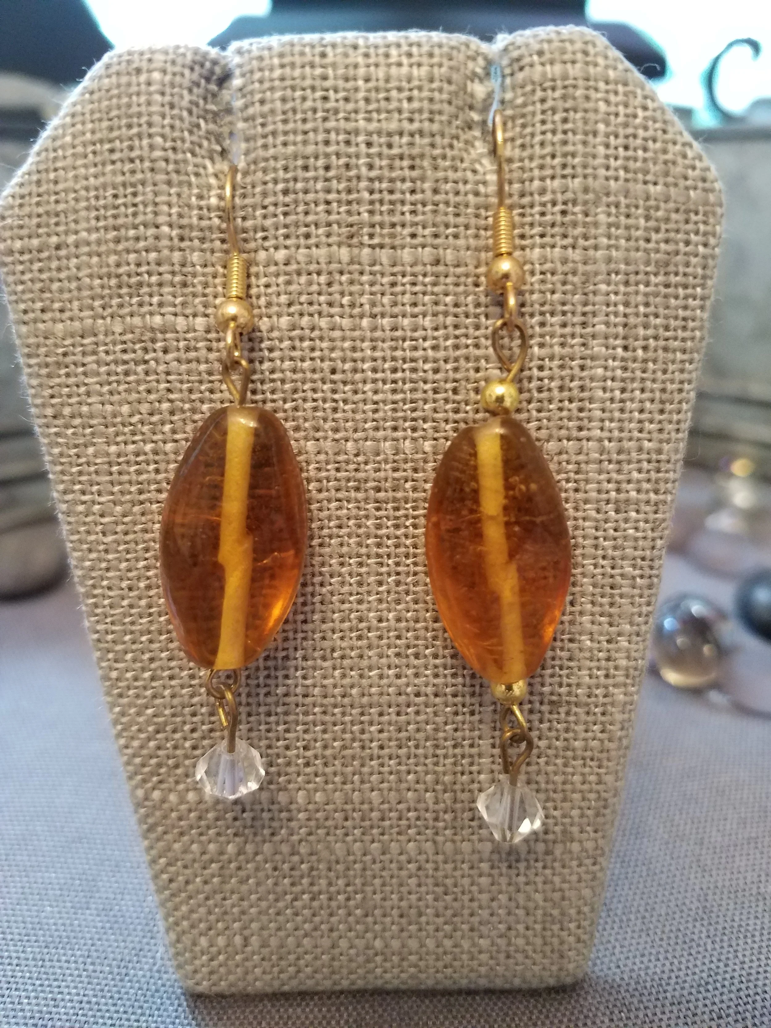 Amber glass beads with clear crystals
