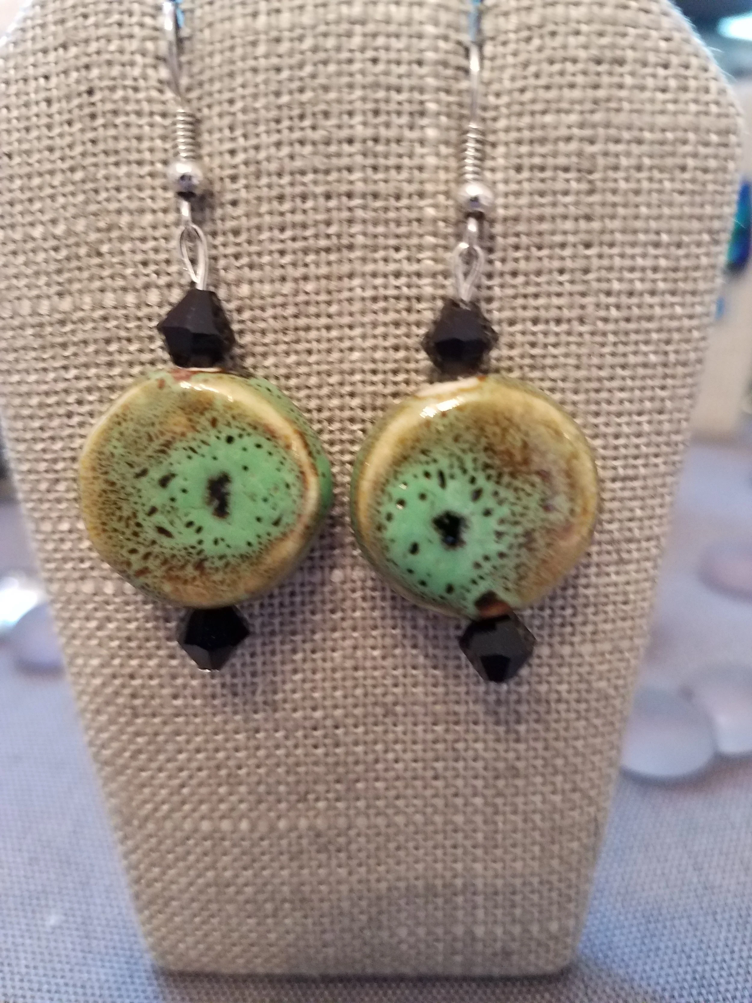 Green ceramic  bead with black crystals