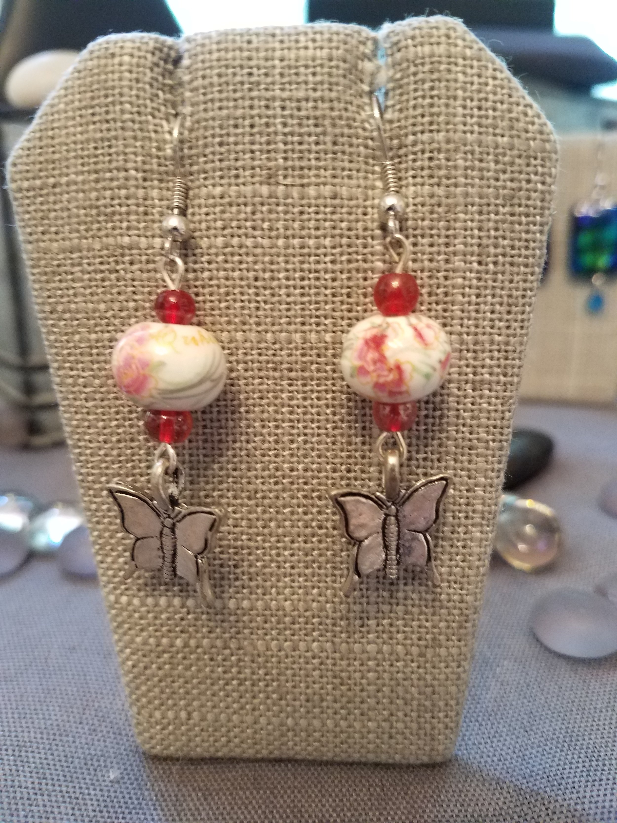 Painted ceramic bead and red glass beads