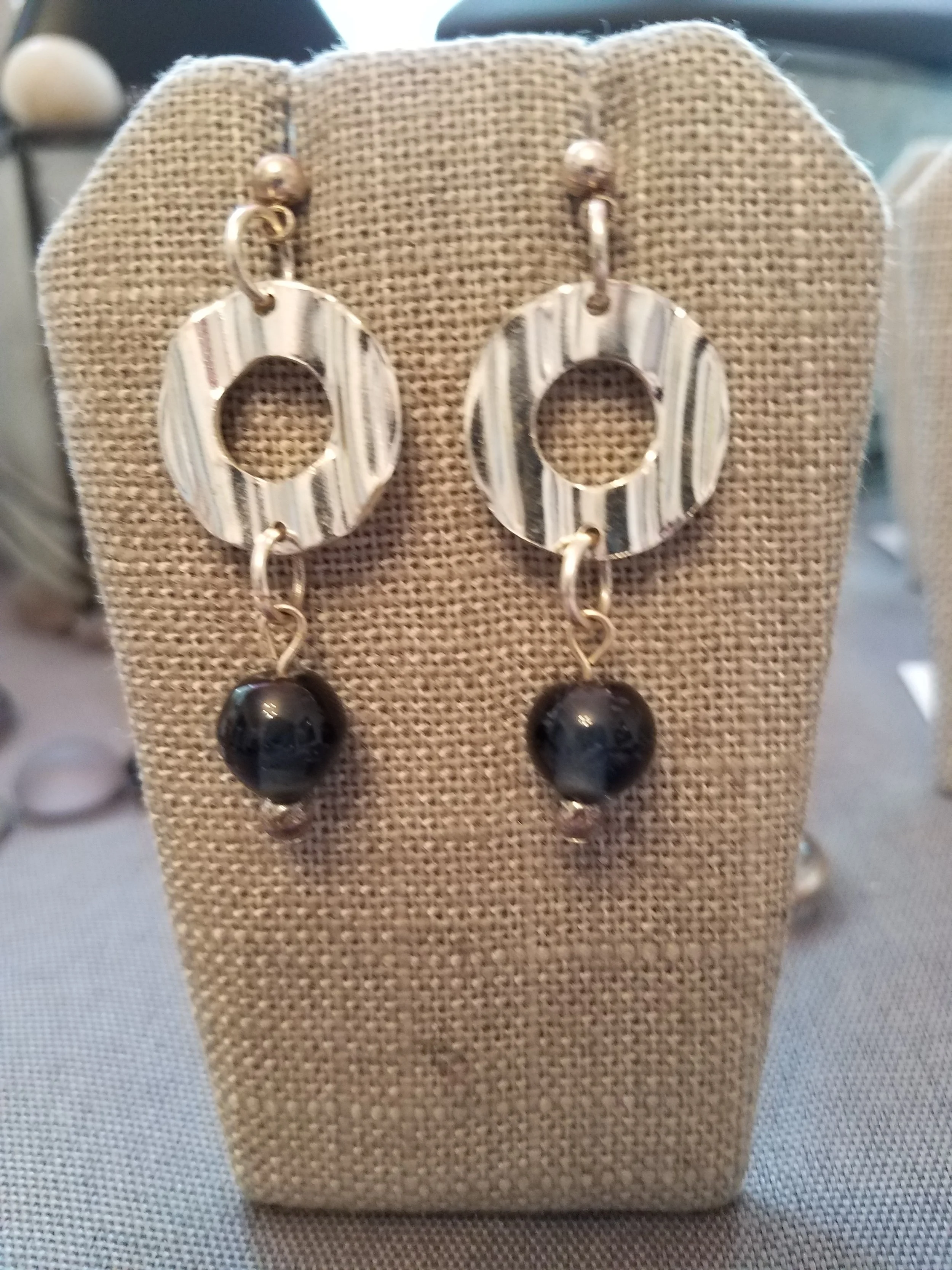 Silver wavy rings with dark teal glass beads