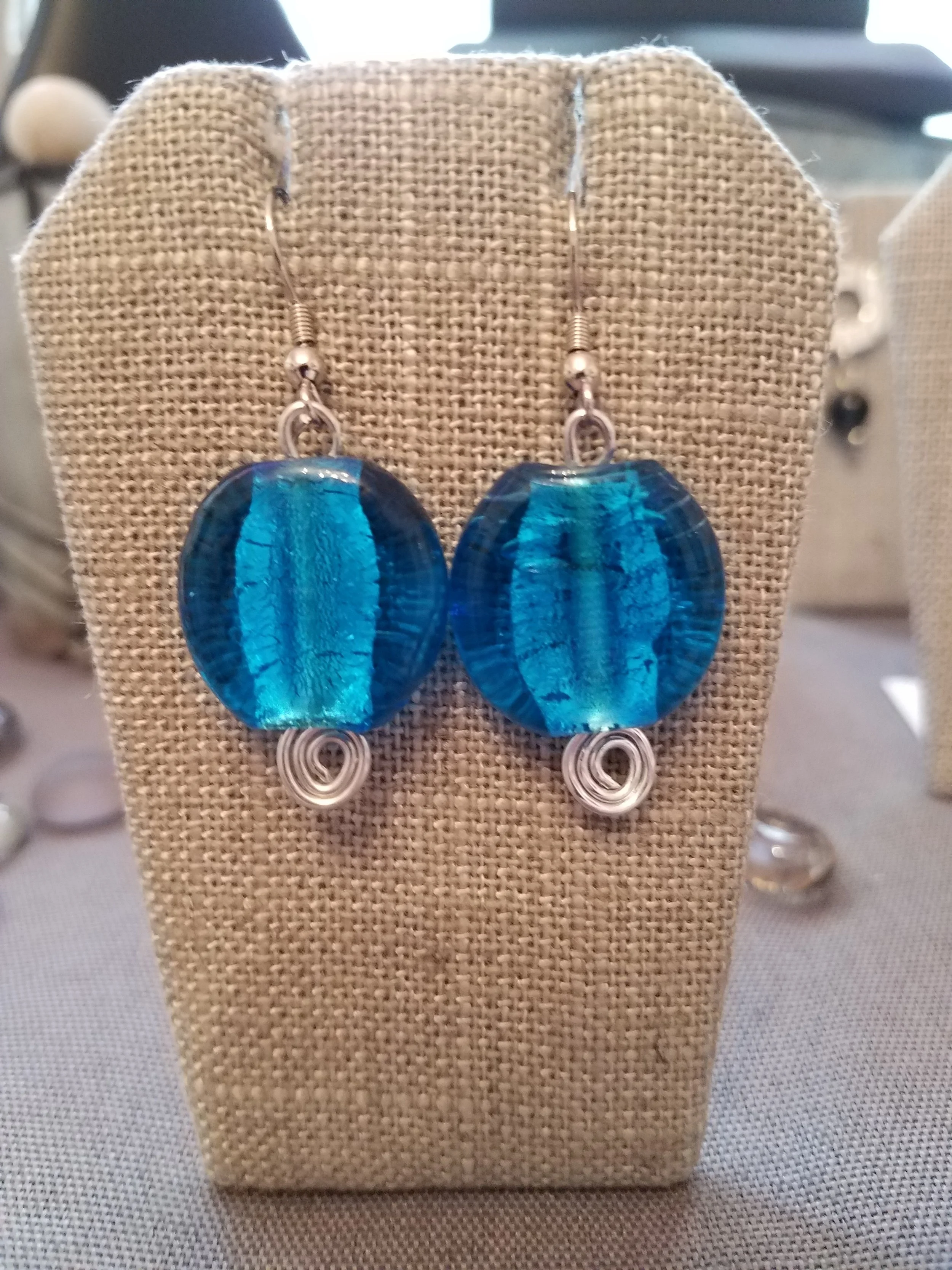 Large murano turquoise blue foil bead with silver curls 