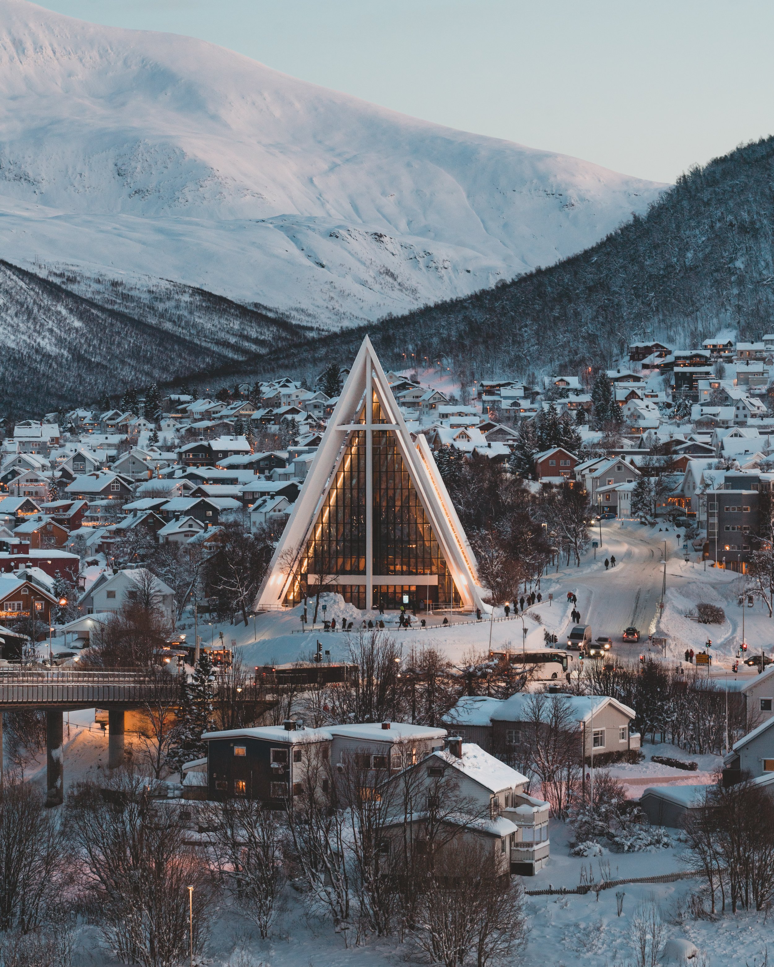 Snowy Tromso at sunset with the Arctic Cathedral at the center